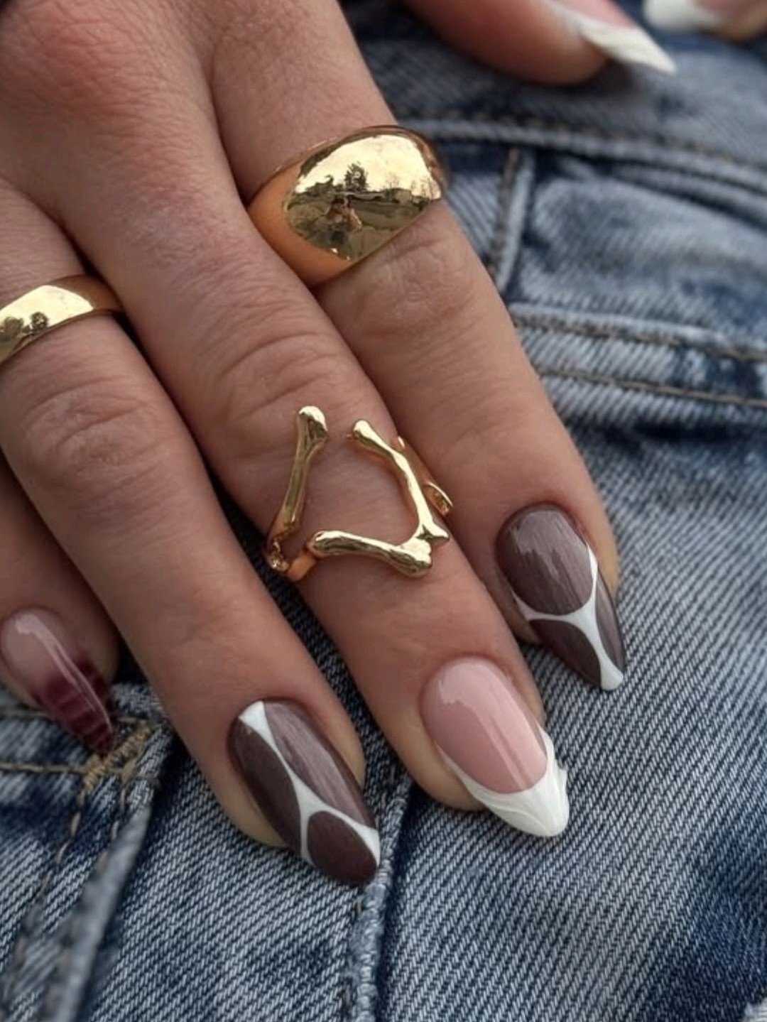 Nude, Brown, and White Almond Nails with Graphic French Tips