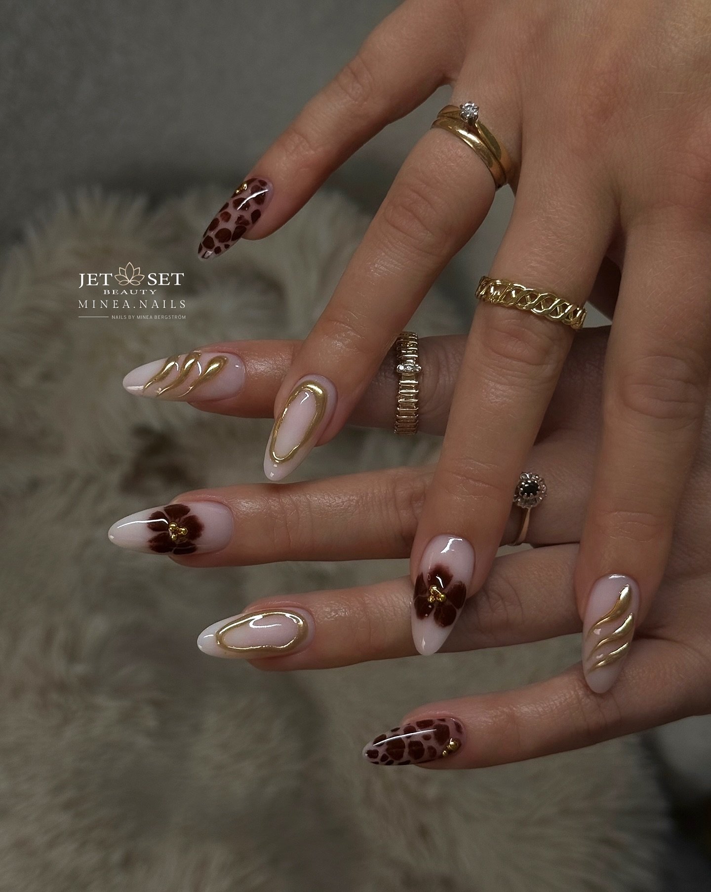 Mixed Brown and Nude Almond Nails with Gold and Animal-Print Details