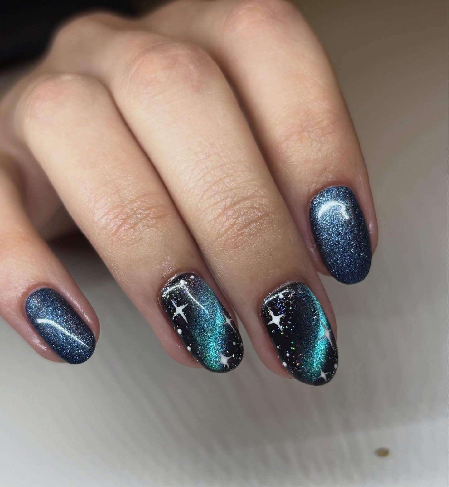 Blue-Black Aura Nails with White Accents