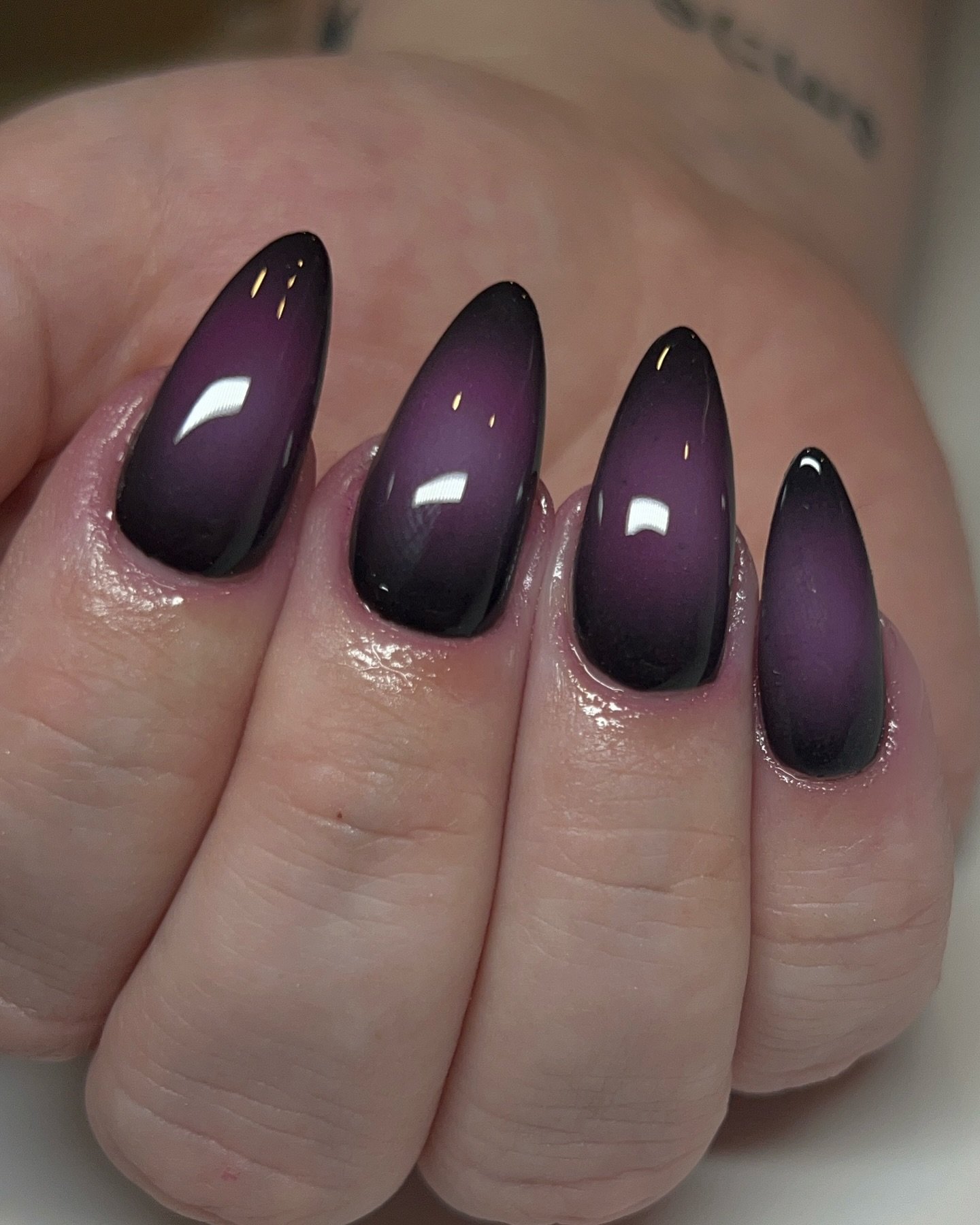 Glossy Dark Plum Almond Nails