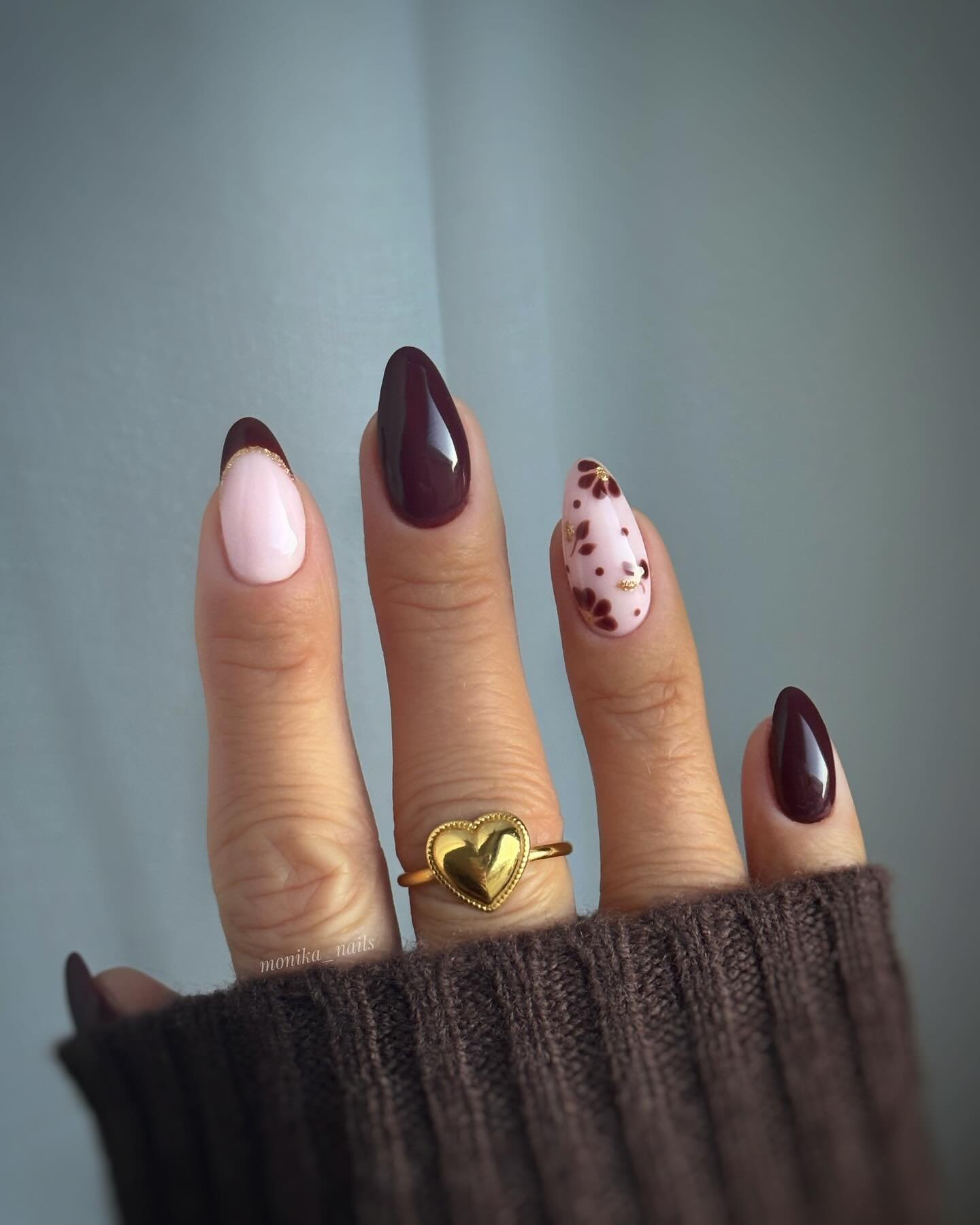 Blush and Burgundy Almond Nails with a Speckled Accent
