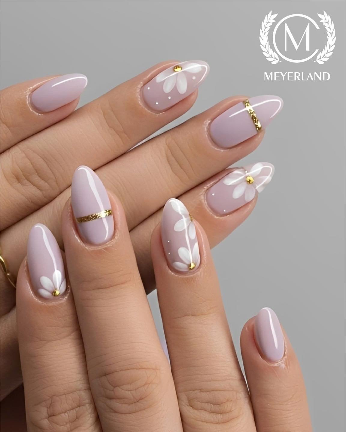 Soft Lilac Nails with Gold Lines and White Floral Details