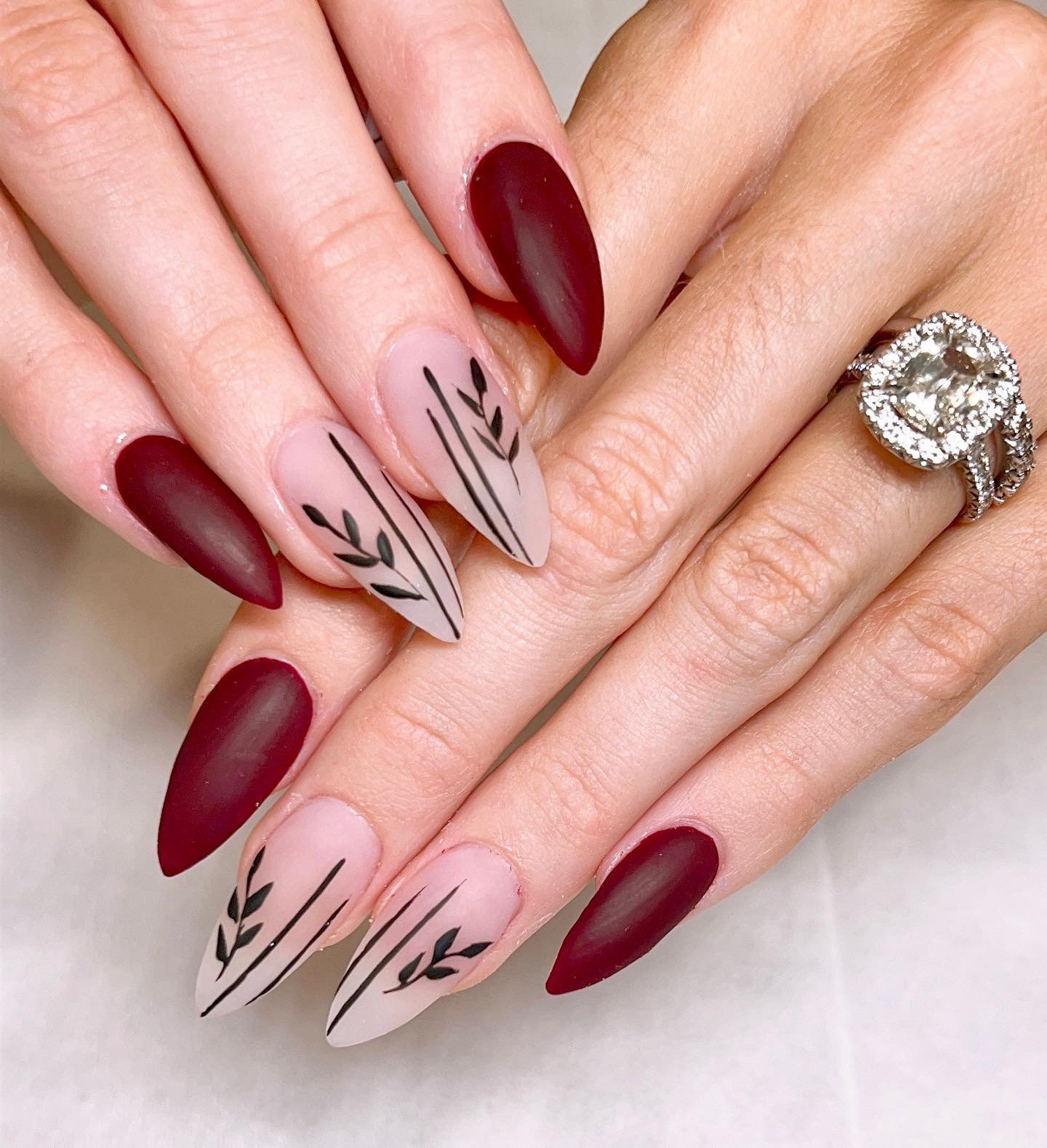 Burgundy Almond Nails with Pale Botanical Line Art
