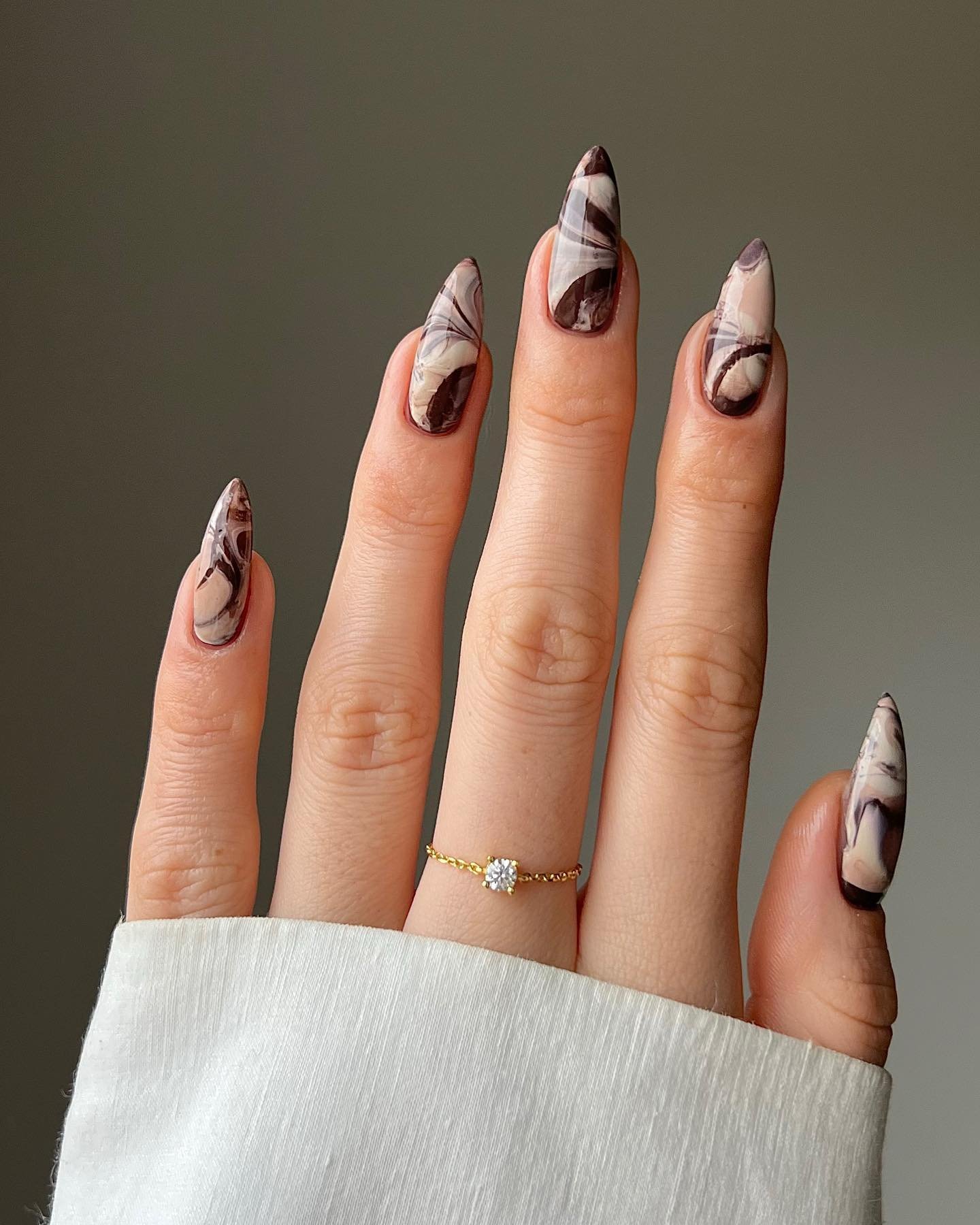 Long Nude Nails with Black and Brown Abstract Marble Details