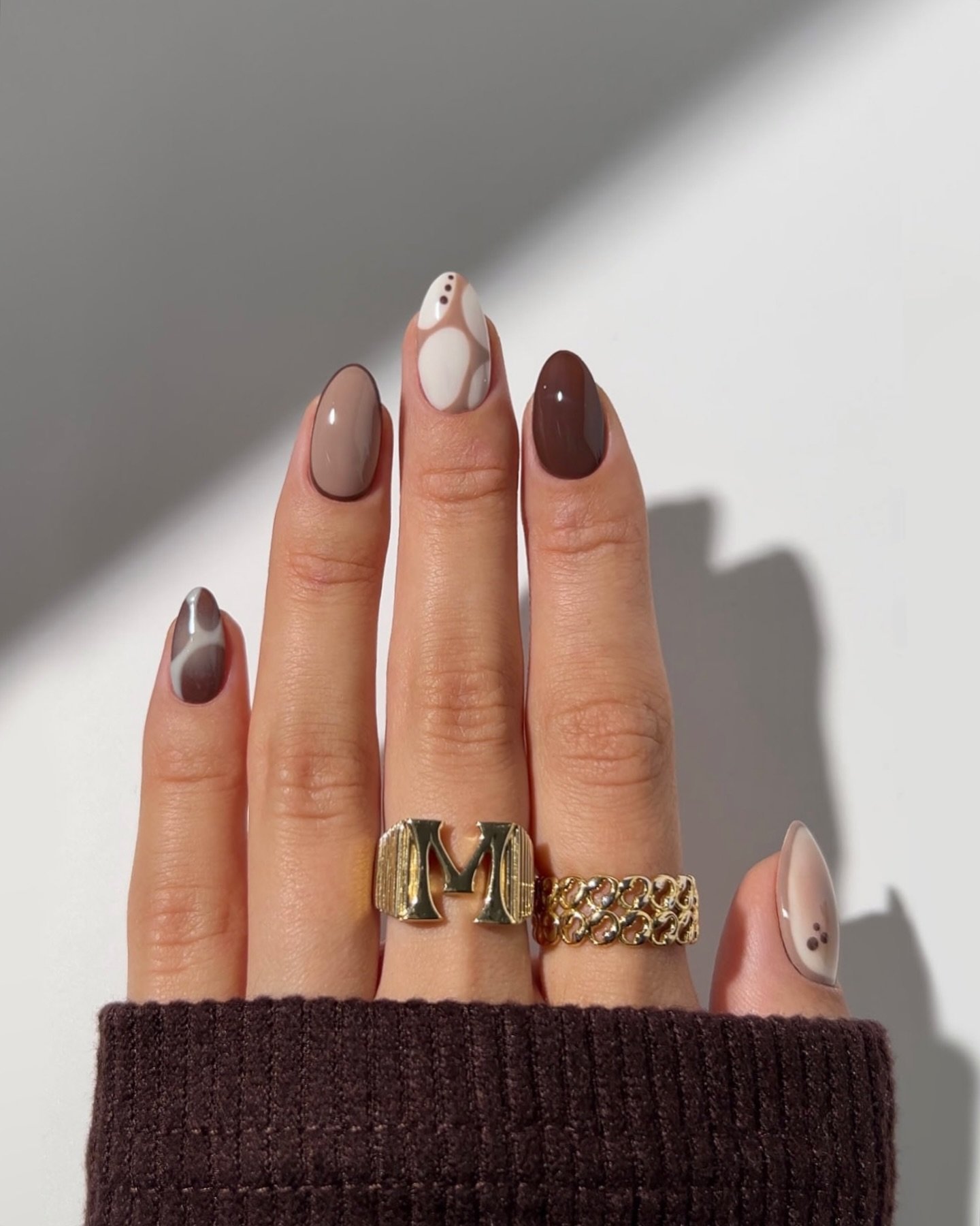 Taupe and Chocolate Almond Nails with a White Floral Accent
