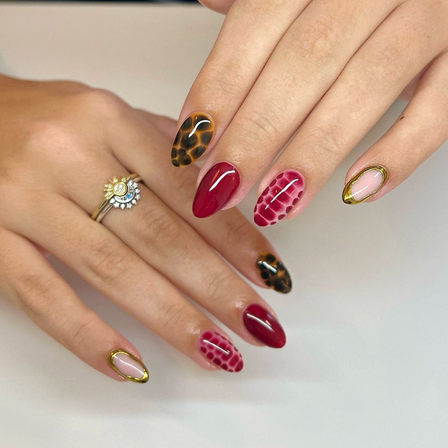 Burgundy, Pink, and Gold Mismatched Almond Nails