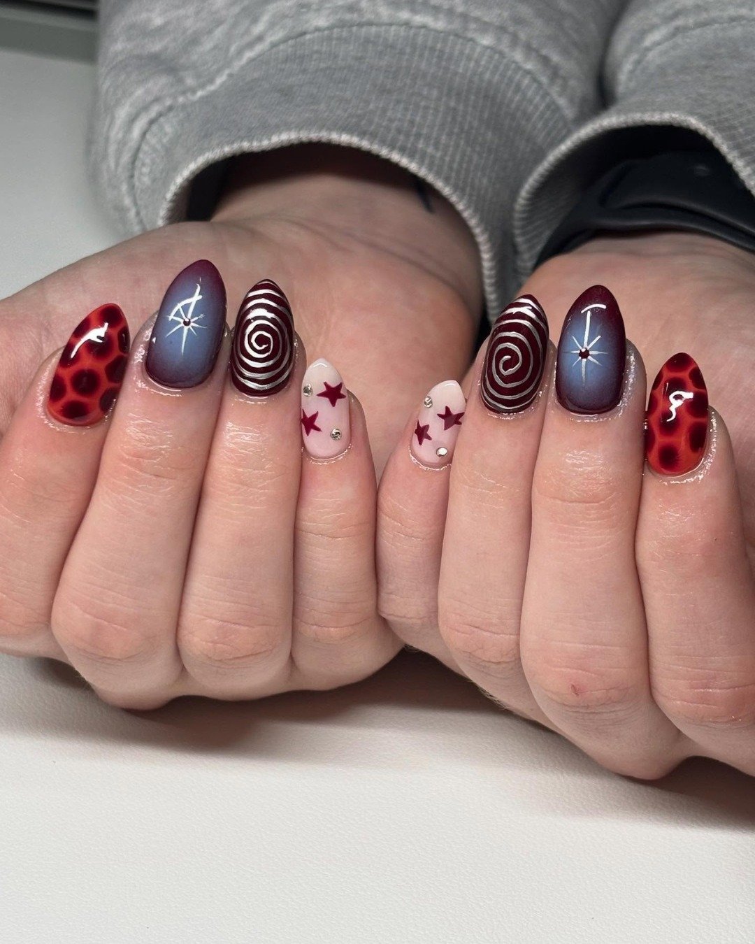 Burgundy and Navy Nails with White Patterned Accents