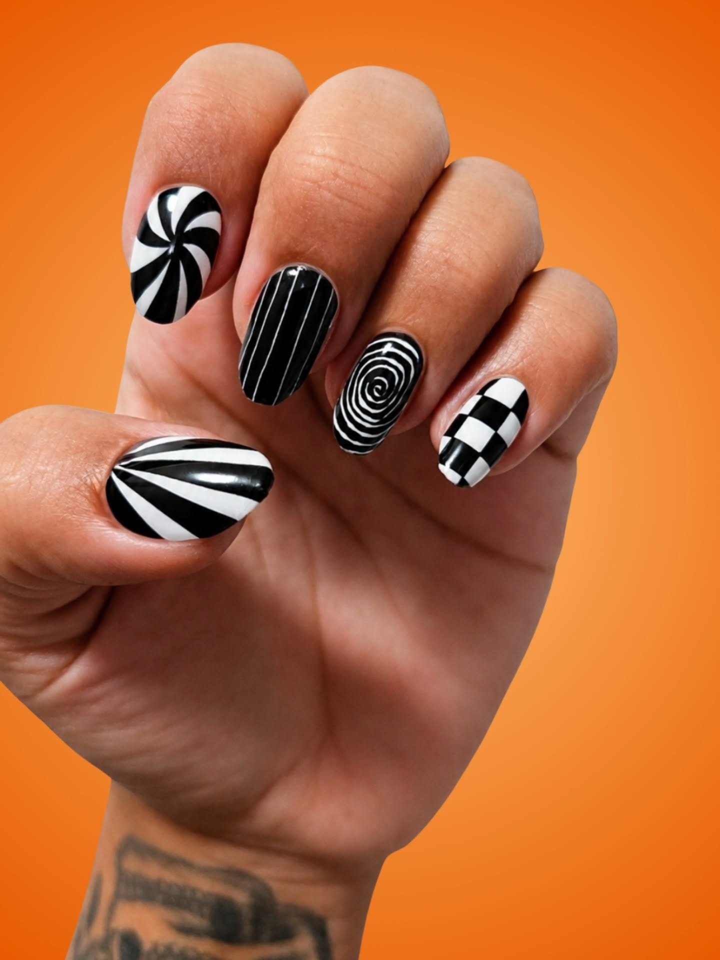 Black and White Graphic Nails with Swirls and Checks