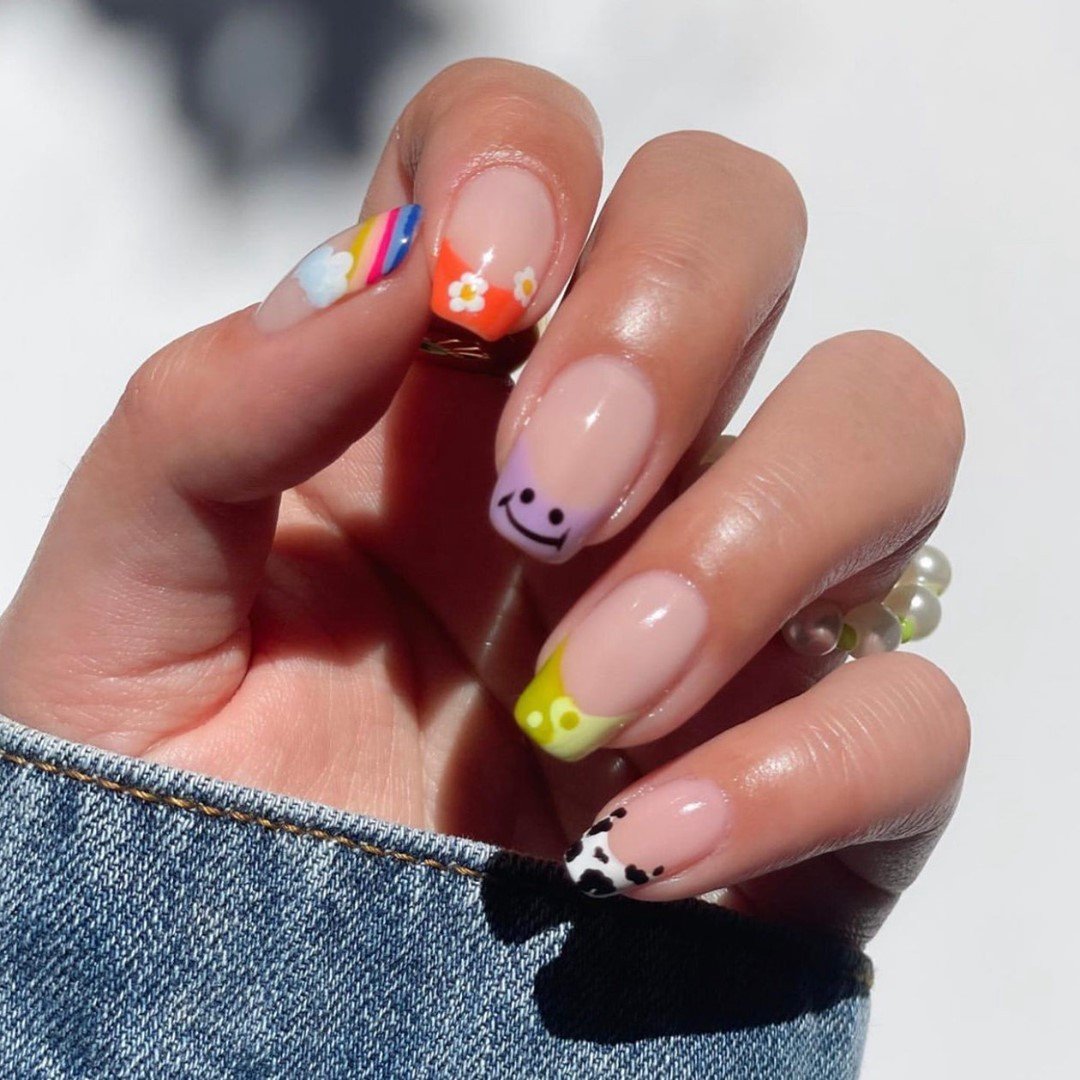 Pastel Pink Nails with Colorful Tips and Tiny Graphics