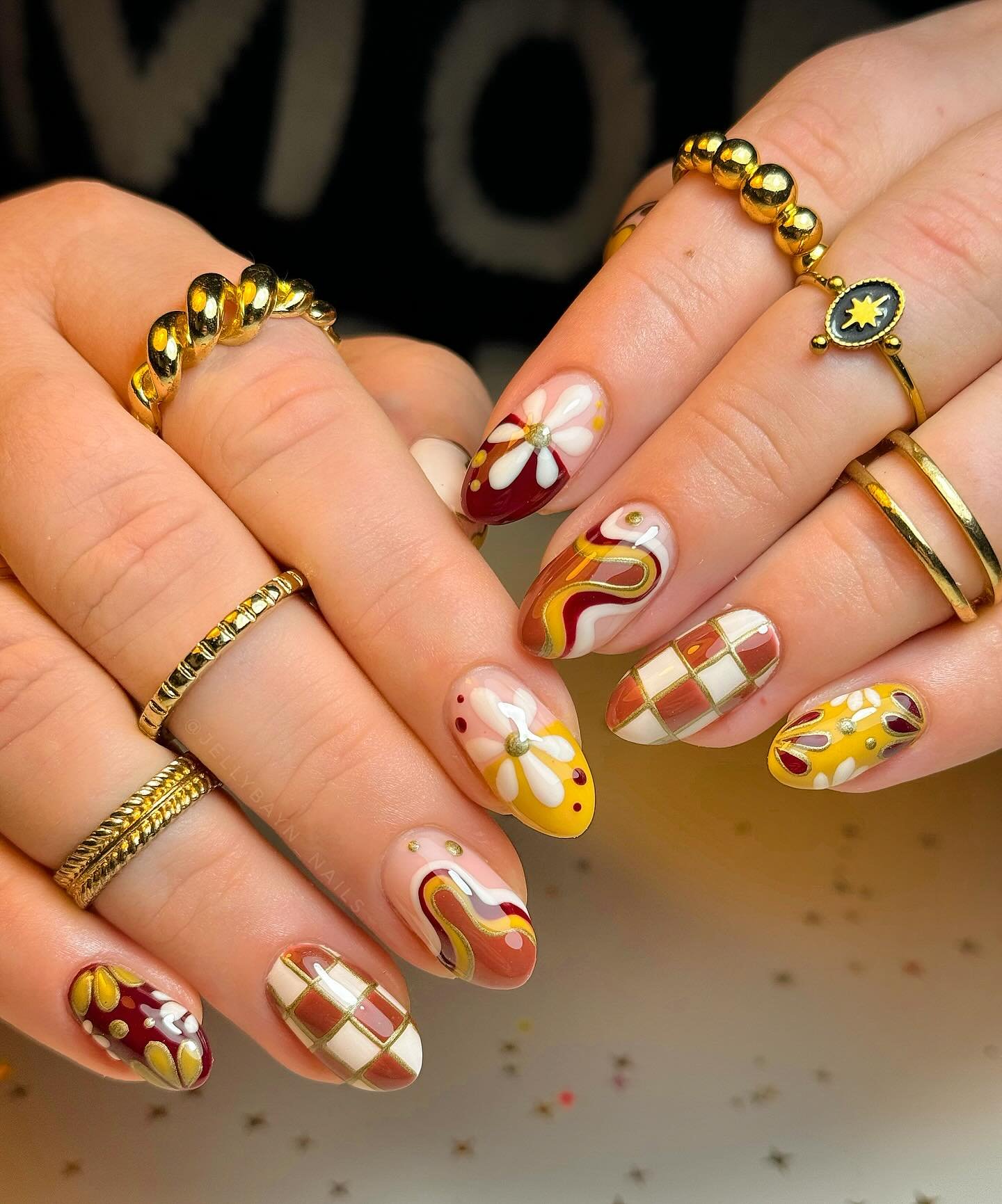 Warm Yellow and Brown Mismatched Almond Nails