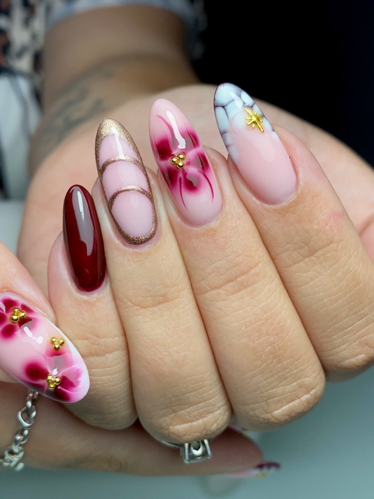 Burgundy and Pink Floral Nails with Gold Details