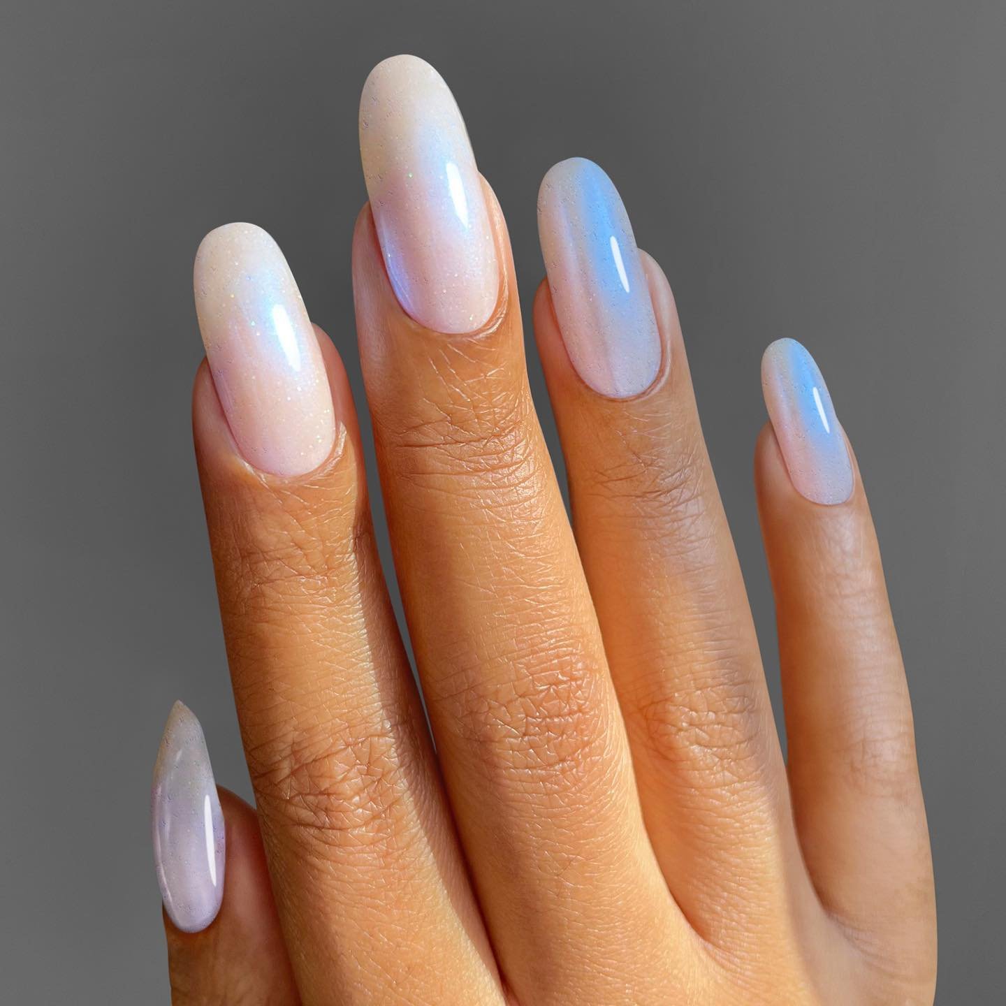 Long Almond Nails with Milky White and Blue Moonstone Tips