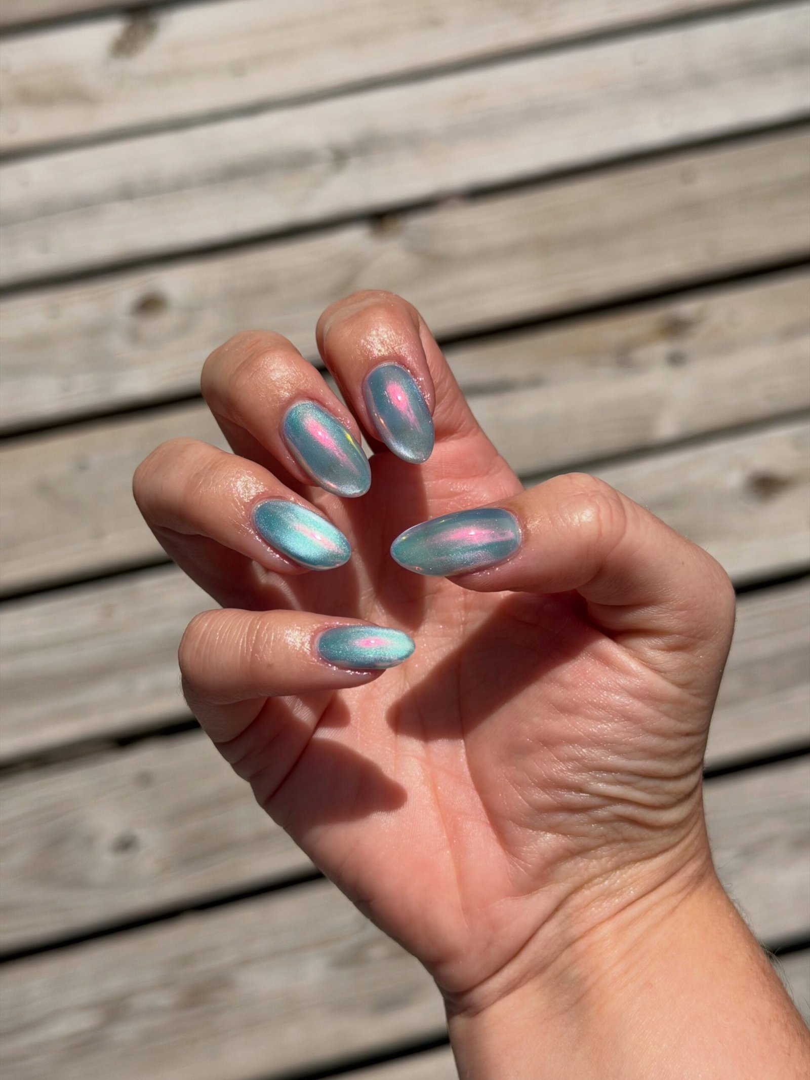 Long Almond Nails with Dark Metallic and Pale Blue Accents