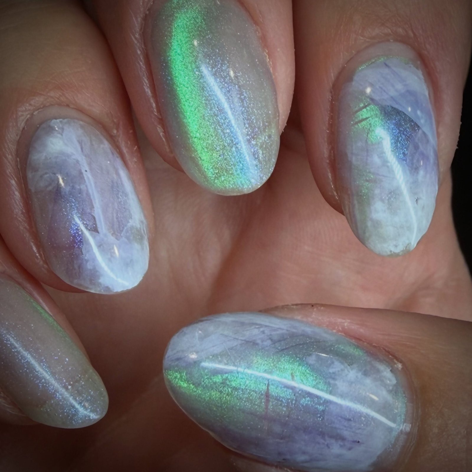 Long Almond Nails with Nude Base and Metallic Silver Details