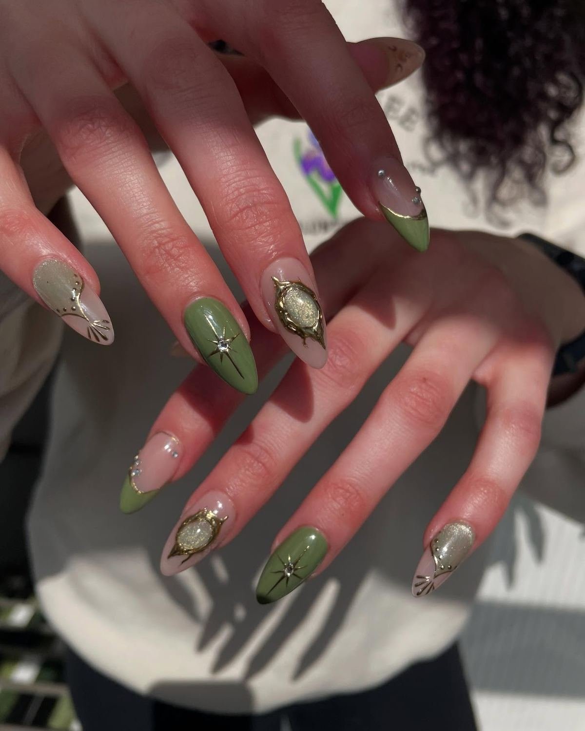 Moss Green Almond Nails with Gold and Rhinestone Accents