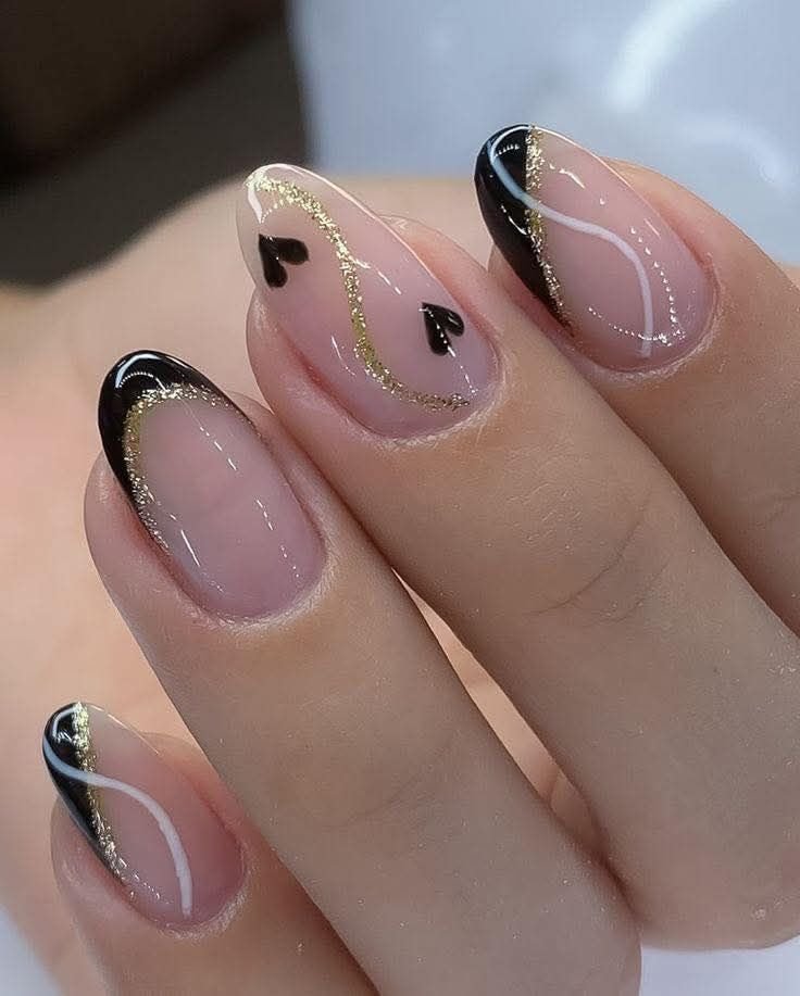 Sheer Pink Almond Nails with Dark Accents