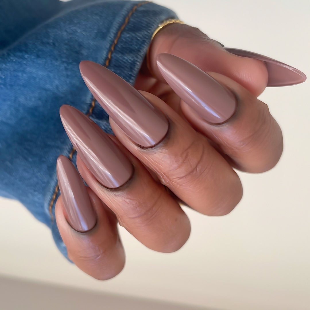 Soft Taupe Almond Nails with a Glossy Finish