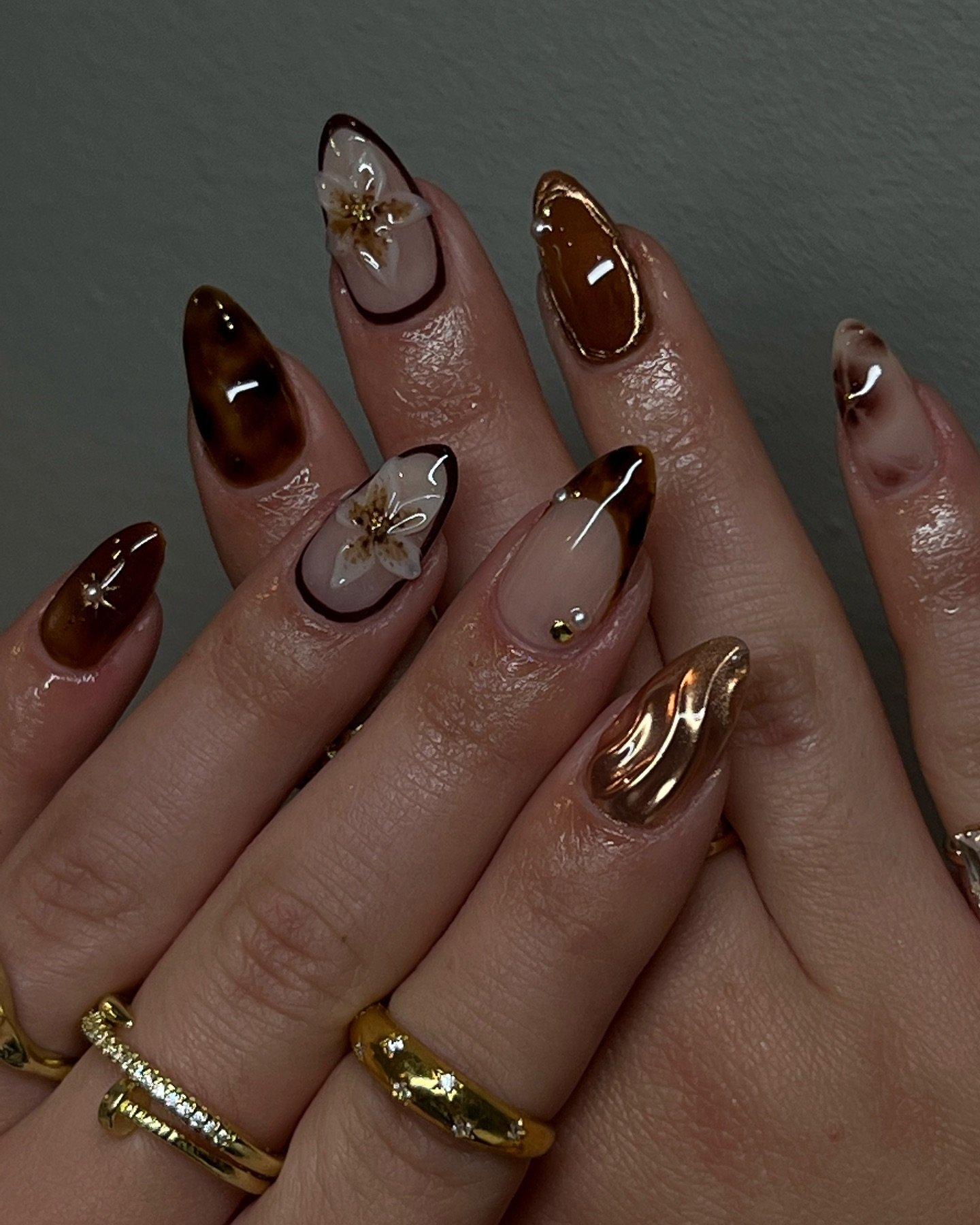 Brown and Nude Almond Nails with Gold Accents