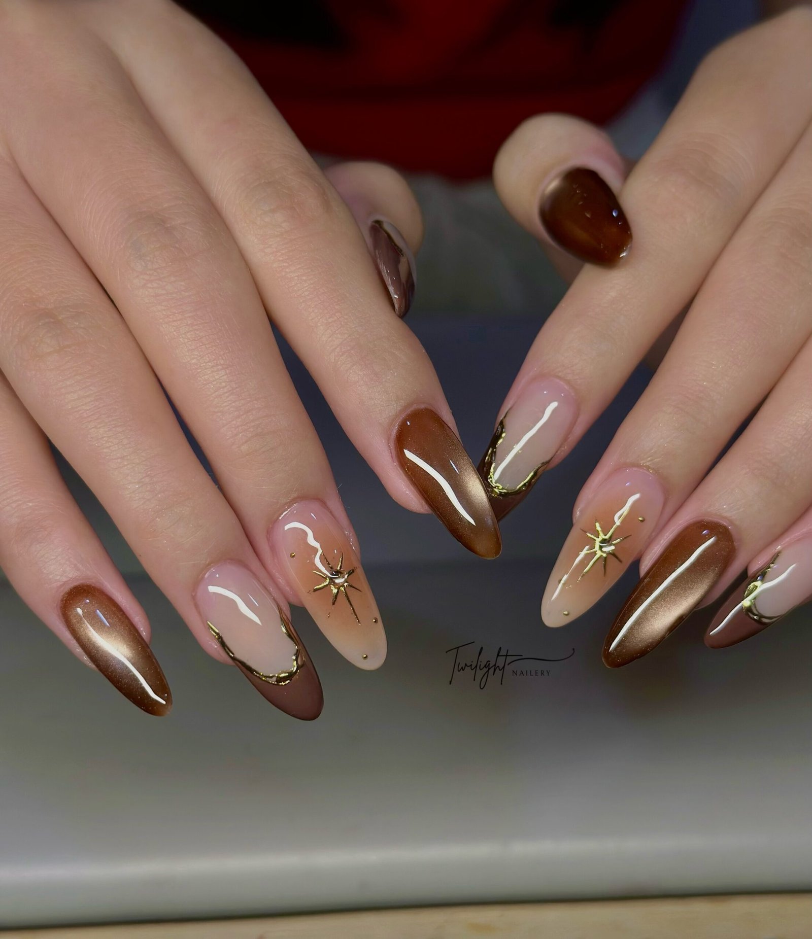 Brown and Nude Almond Nails with Fine Gold Lines