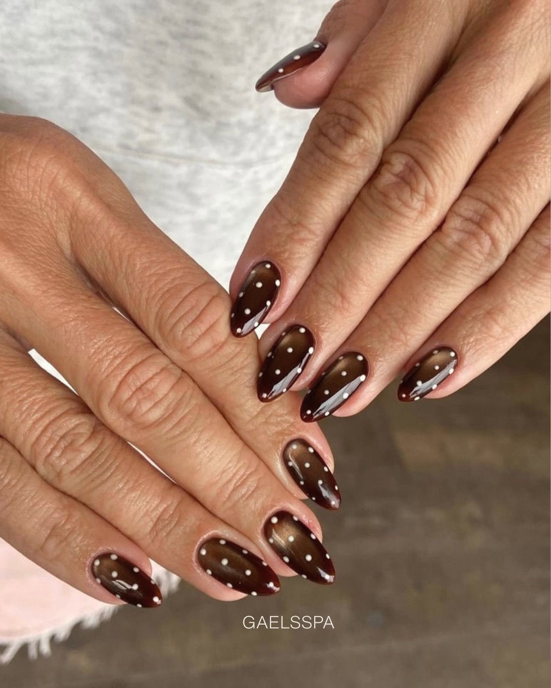 Dark Brown Almond Nails with Tiny White Dots