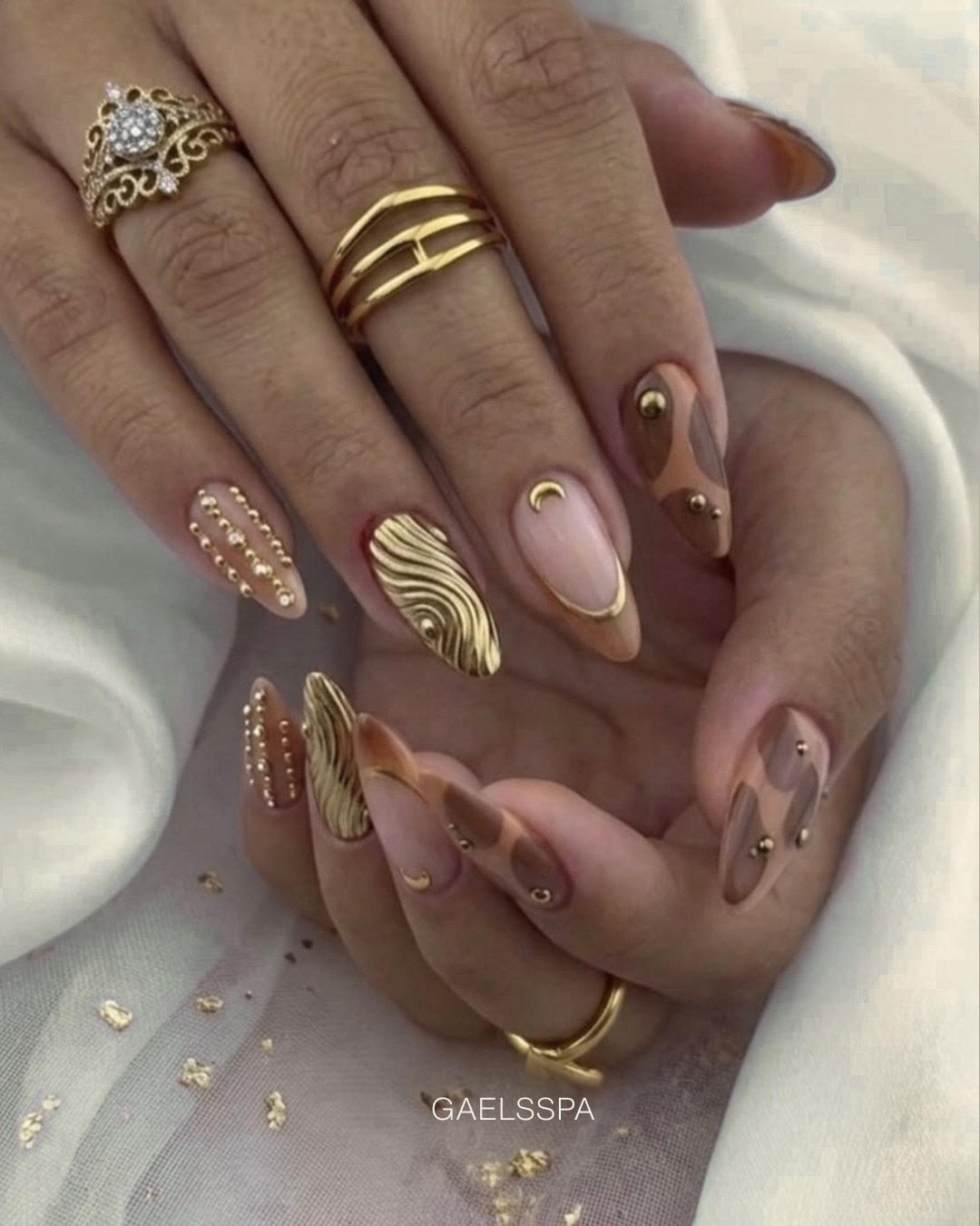 Taupe Almond Nails with Gold and Embossed Details