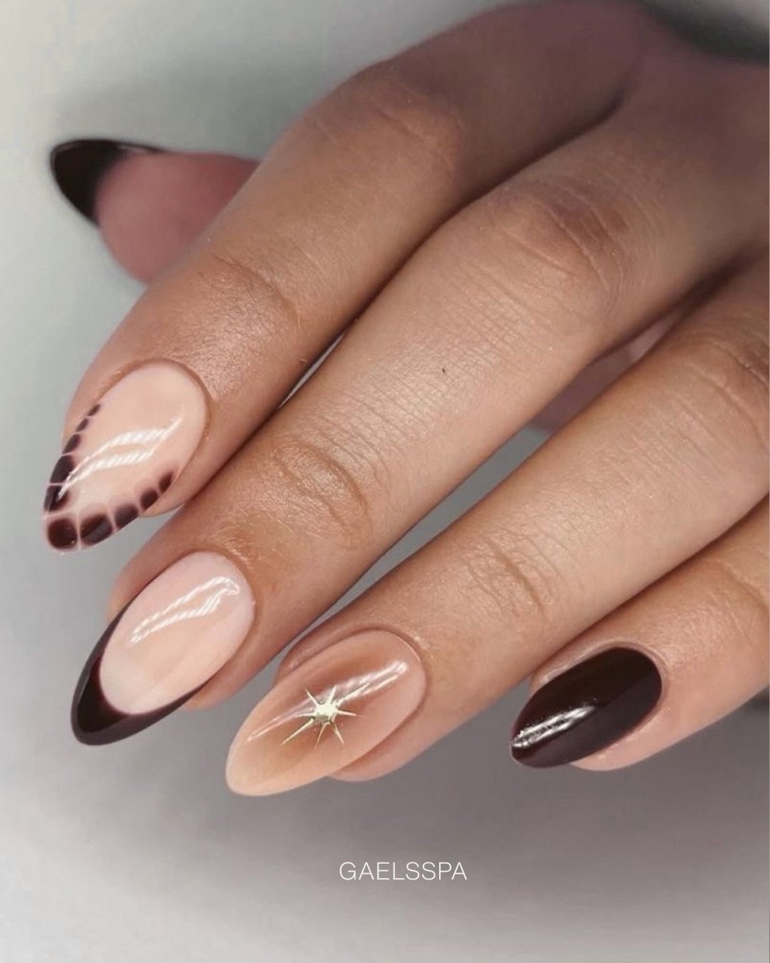 Blush Almond Nails with Brown French Tips and Fine White Lines