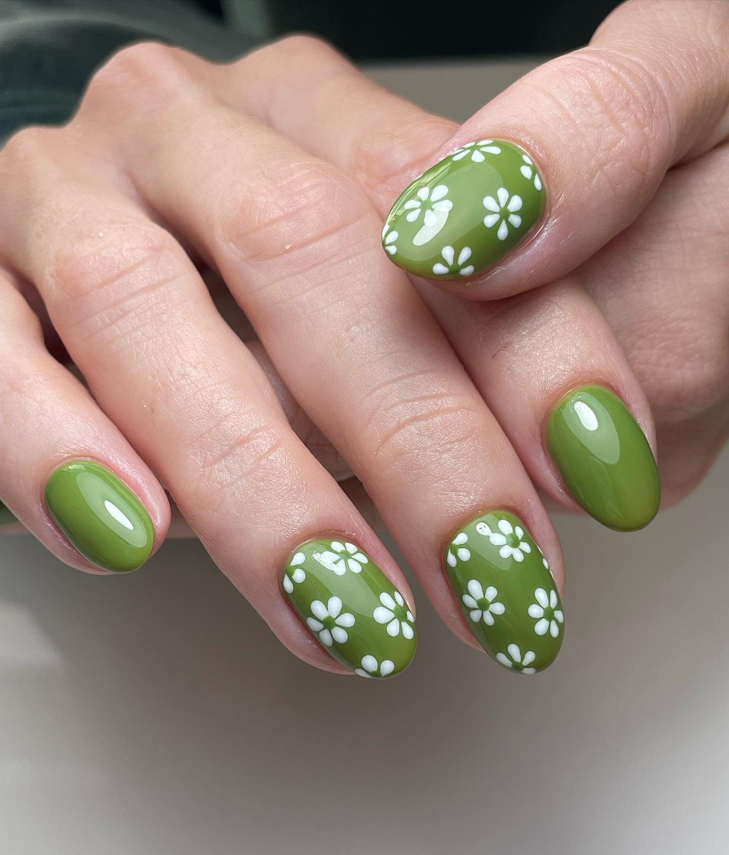 Green Nails with Clusters of Small White Flowers — C_0-ACWgHqTNails by Stacey Griffiths.jpg
