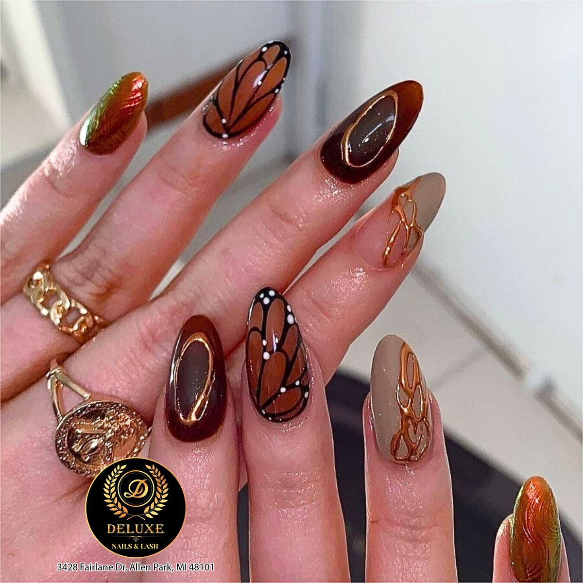 Brown Glossy Nails with Fine Botanical Line Art — DGir2erM13RDeluxe Nails Spa & Lash.jpg