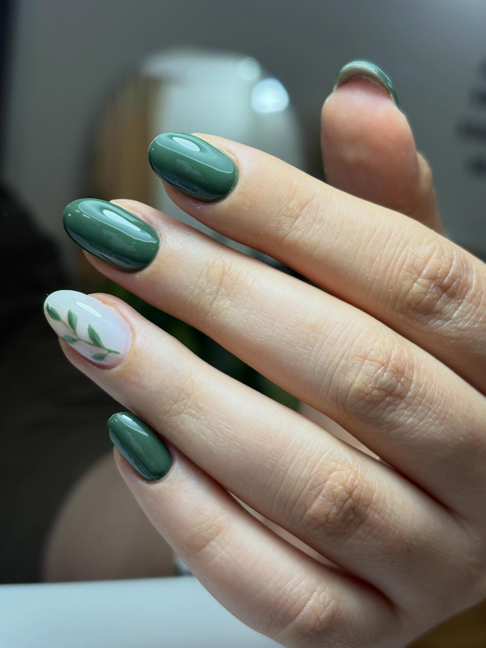 Glossy Deep Green Nails with White Botanical Accents — DcIeSVzsYKhsogand.jpg