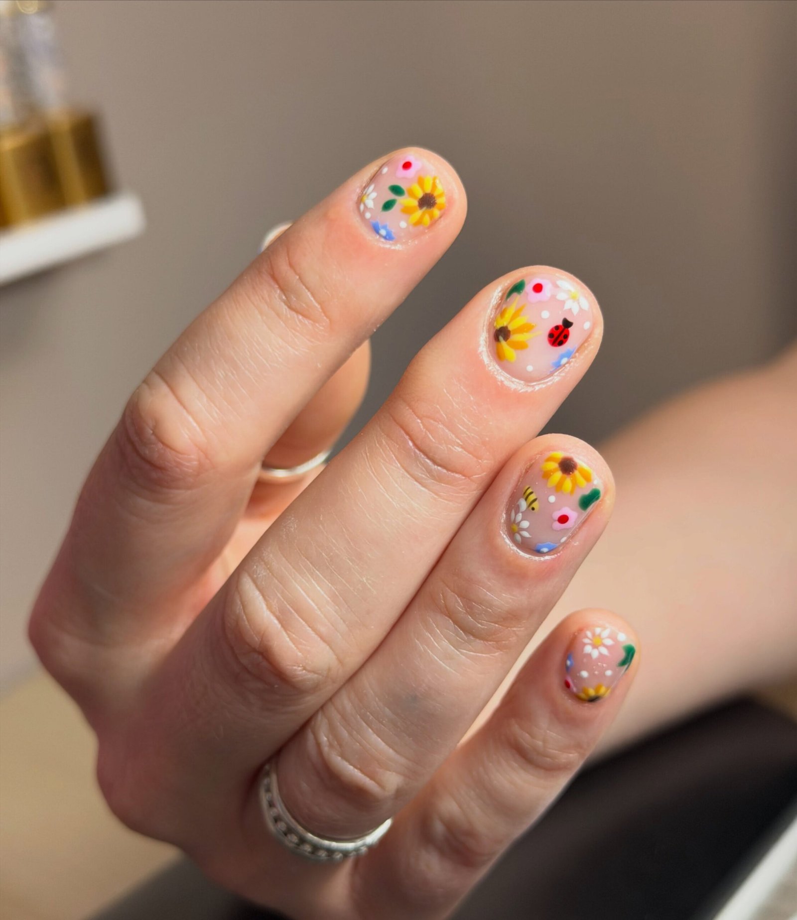 Peachy Nude Nails with Colorful Tiny Flower Art — DbBaa5nI_D1Megan Nail Tech.jpg