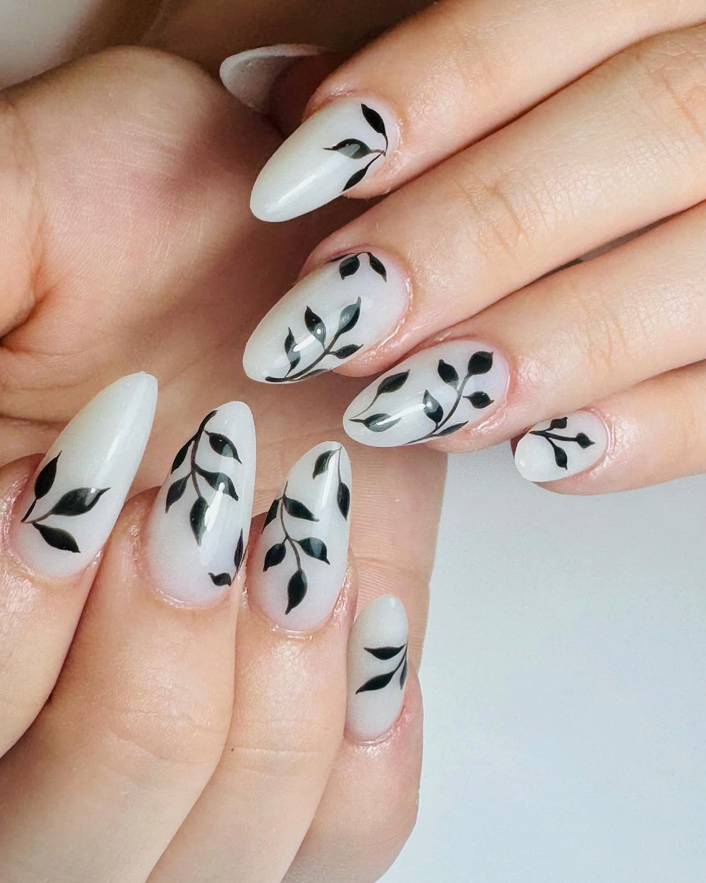 White Nails with Black Botanical Leaf Silhouettes — DJcICVrJlJcLuxor Nail Salon Gladstone.jpg