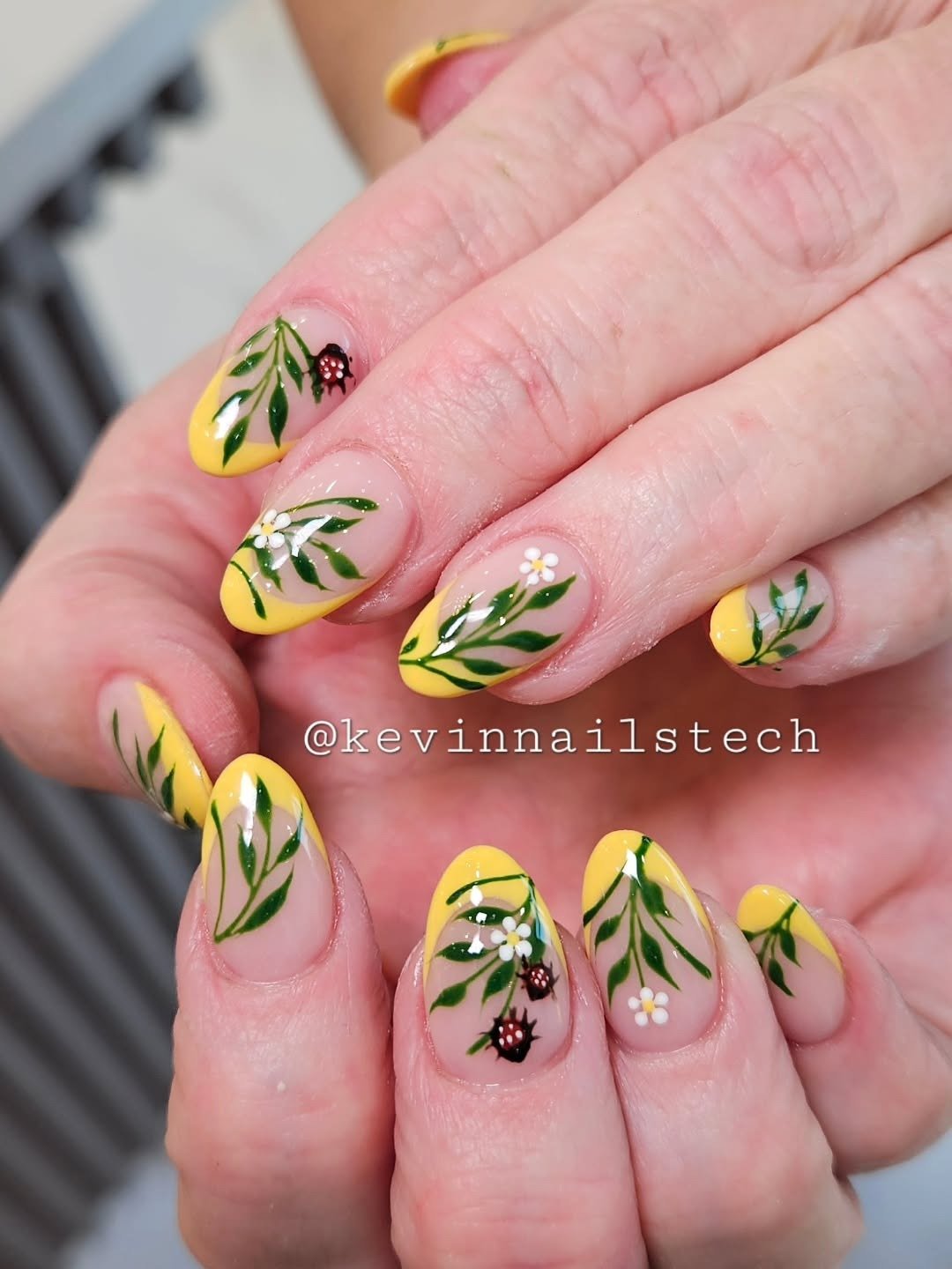 Yellow and Nude Nails with Green Leaf Accents — DWz-HnGEZFYKevin Ho.heic