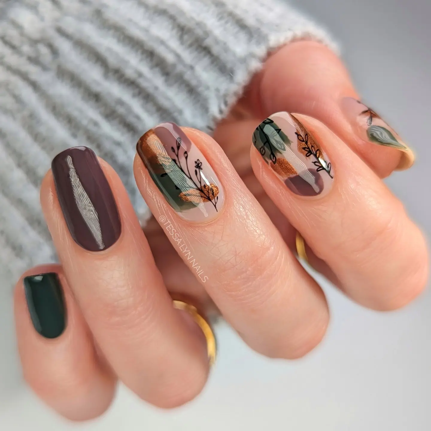 Brown and Teal Short Nails with Patterned Accents