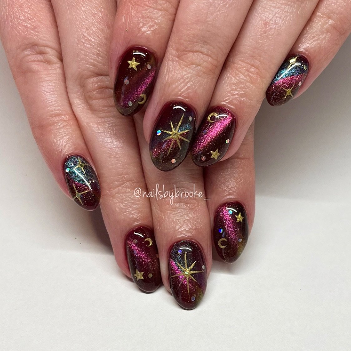 Burgundy Nails with Gold Starburst Details
