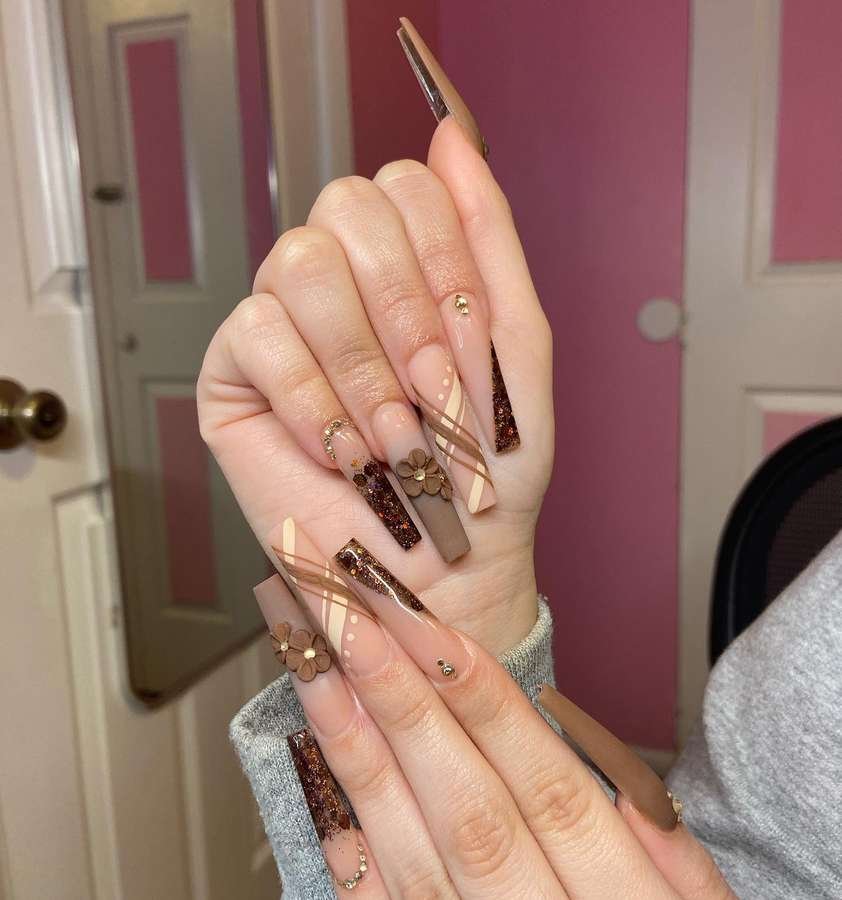 Deep Brown Almond Nails with Gold Leaf Accents