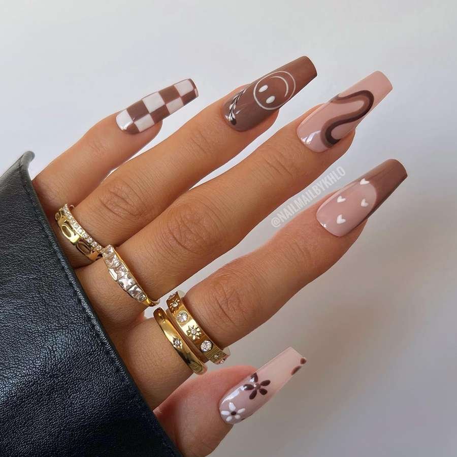 Brown French-Tip Nails with Swirls and Small Accents