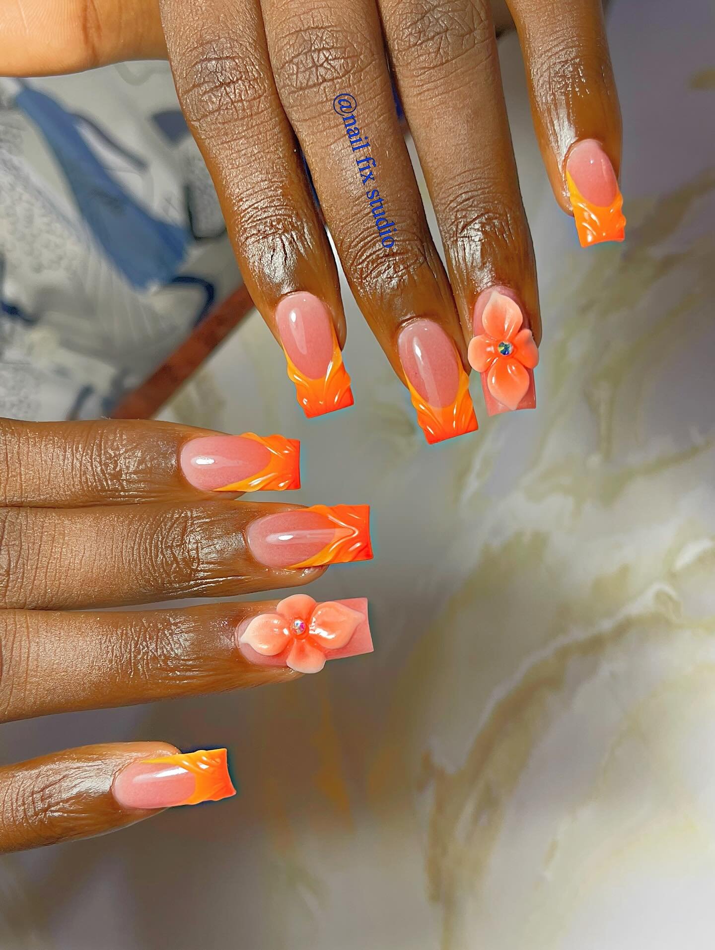 Orange French Tips with Small 3D Flower Accents nail design