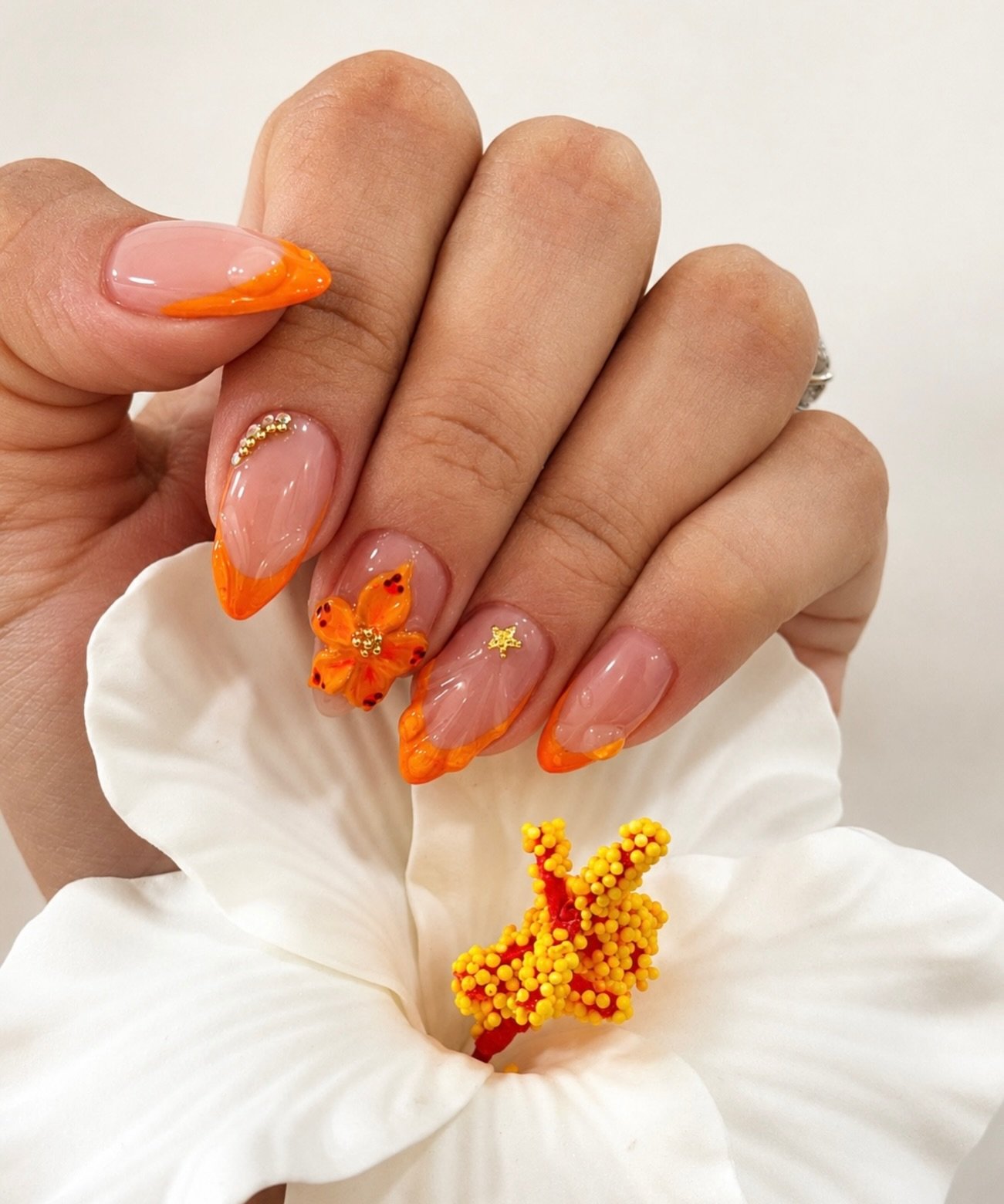 Orange French Tips with Floral Embellishments nail design