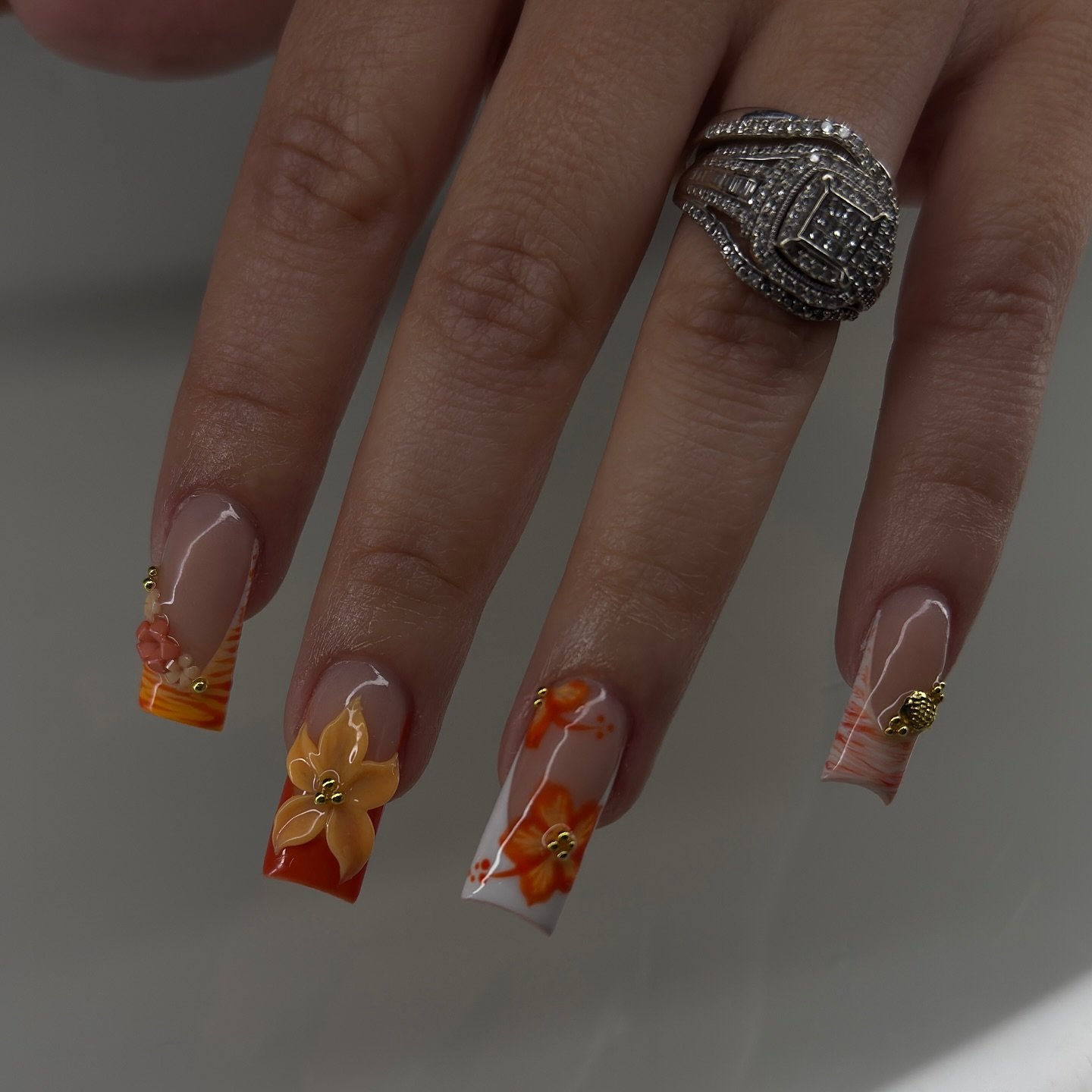 Orange French Tips with Raised Floral and Jewel Details nail design