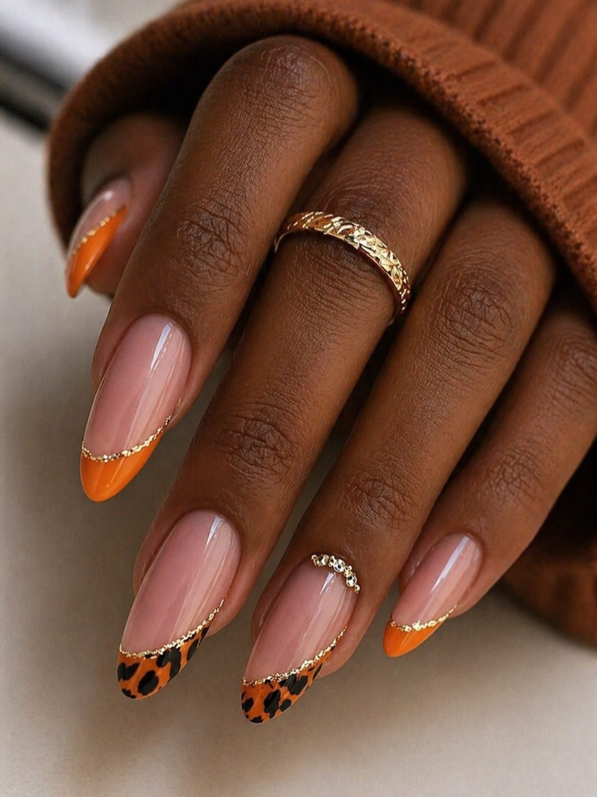Orange French Tips with Leopard-Print Accents nail design