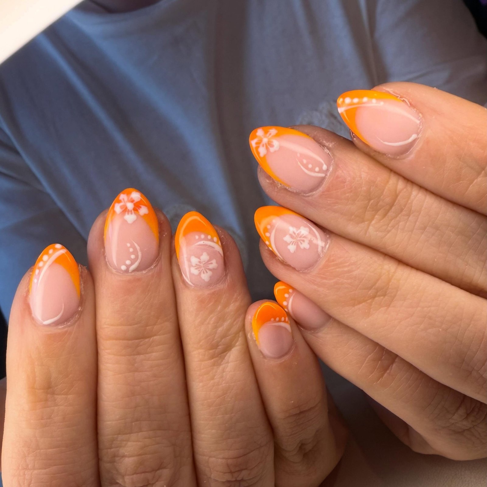 Orange French Tips with Delicate White Accents nail design