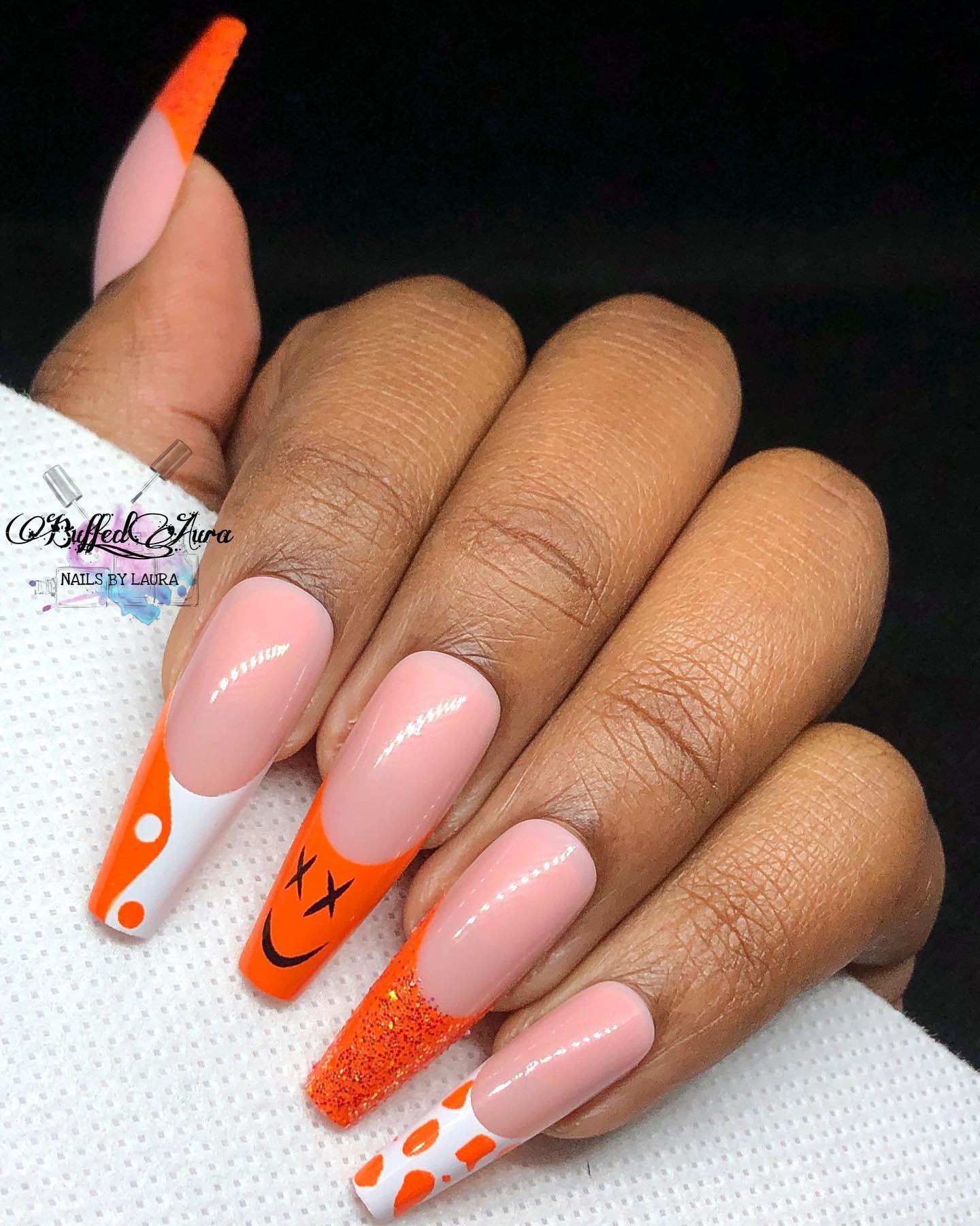 Orange French Tips with Black Graphic Accents nail design