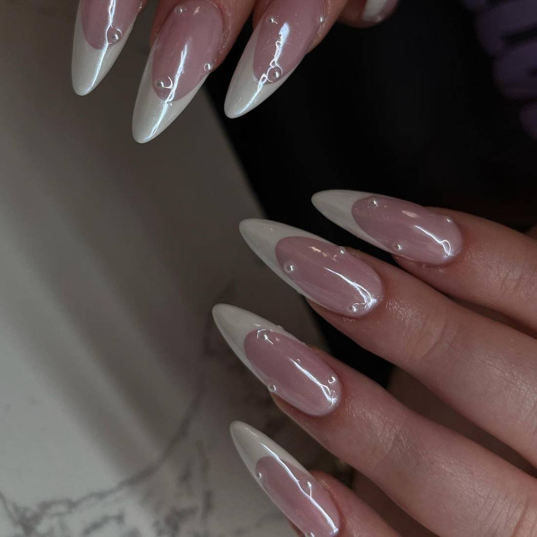Glossy Pink Almond Nails with White Chrome Tips