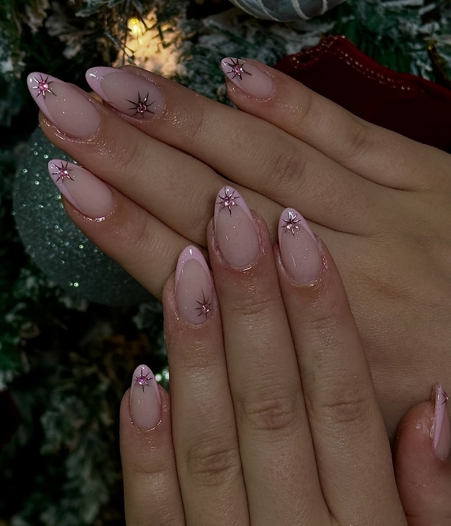 Soft Pink Almond Nails with Tiny Starburst Accents