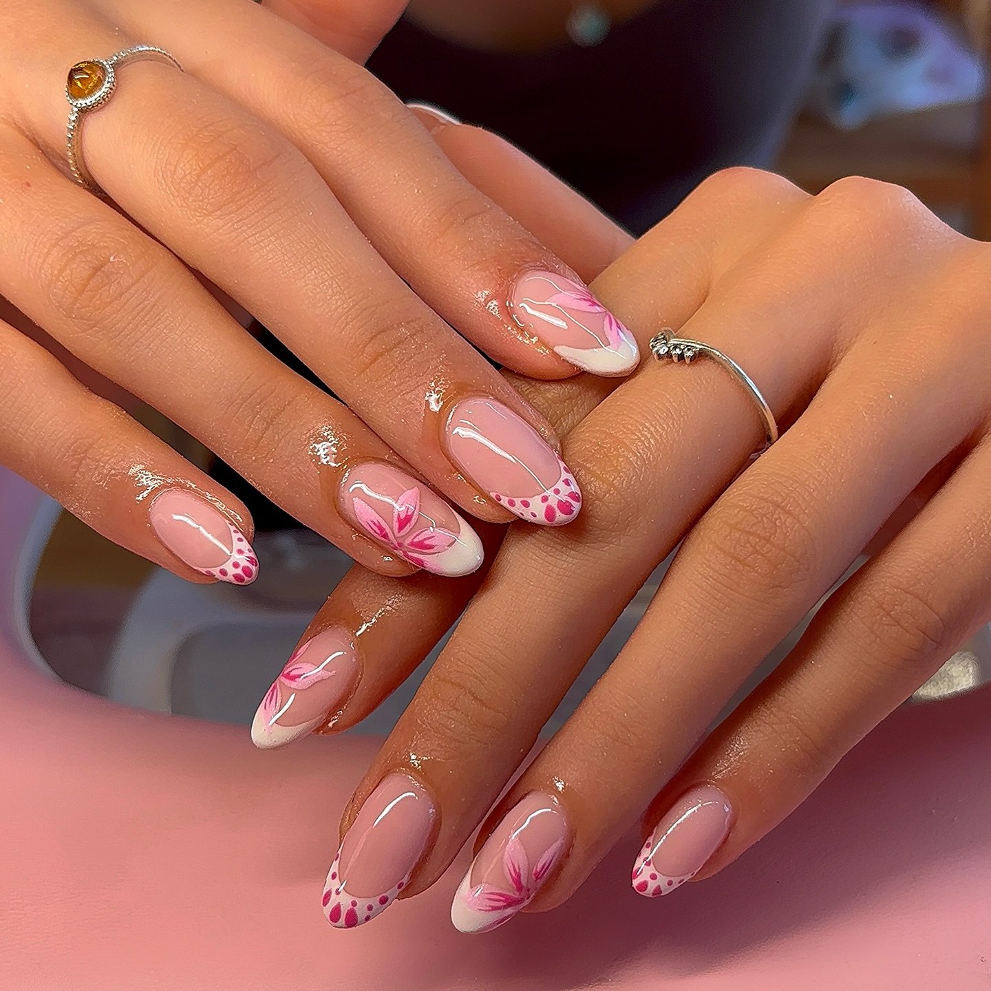 Sheer Pink Almond Nails with Delicate Festive Accents