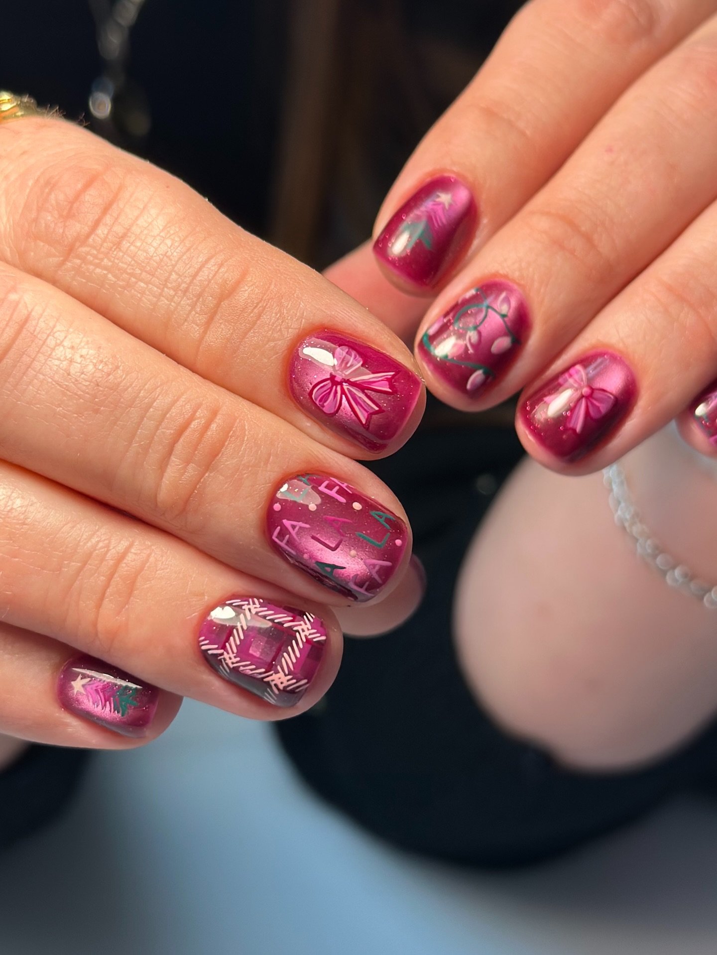 Berry Pink Christmas Nails with Plaid and Festive Art