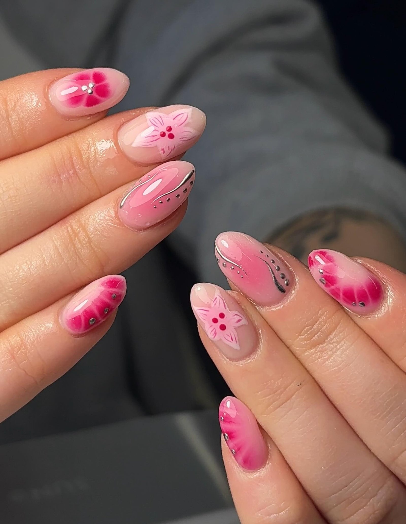 Pink Almond Nails with Swirls and Dotted Accents