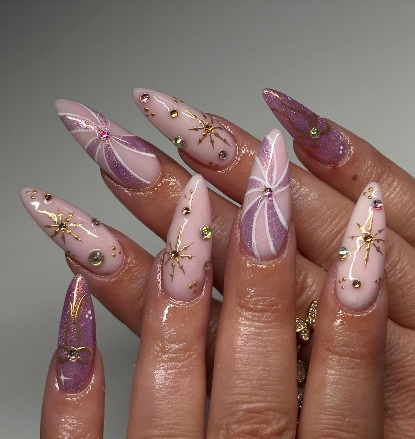 Long Pink and Purple Stiletto Nails with Bow and Gold Details