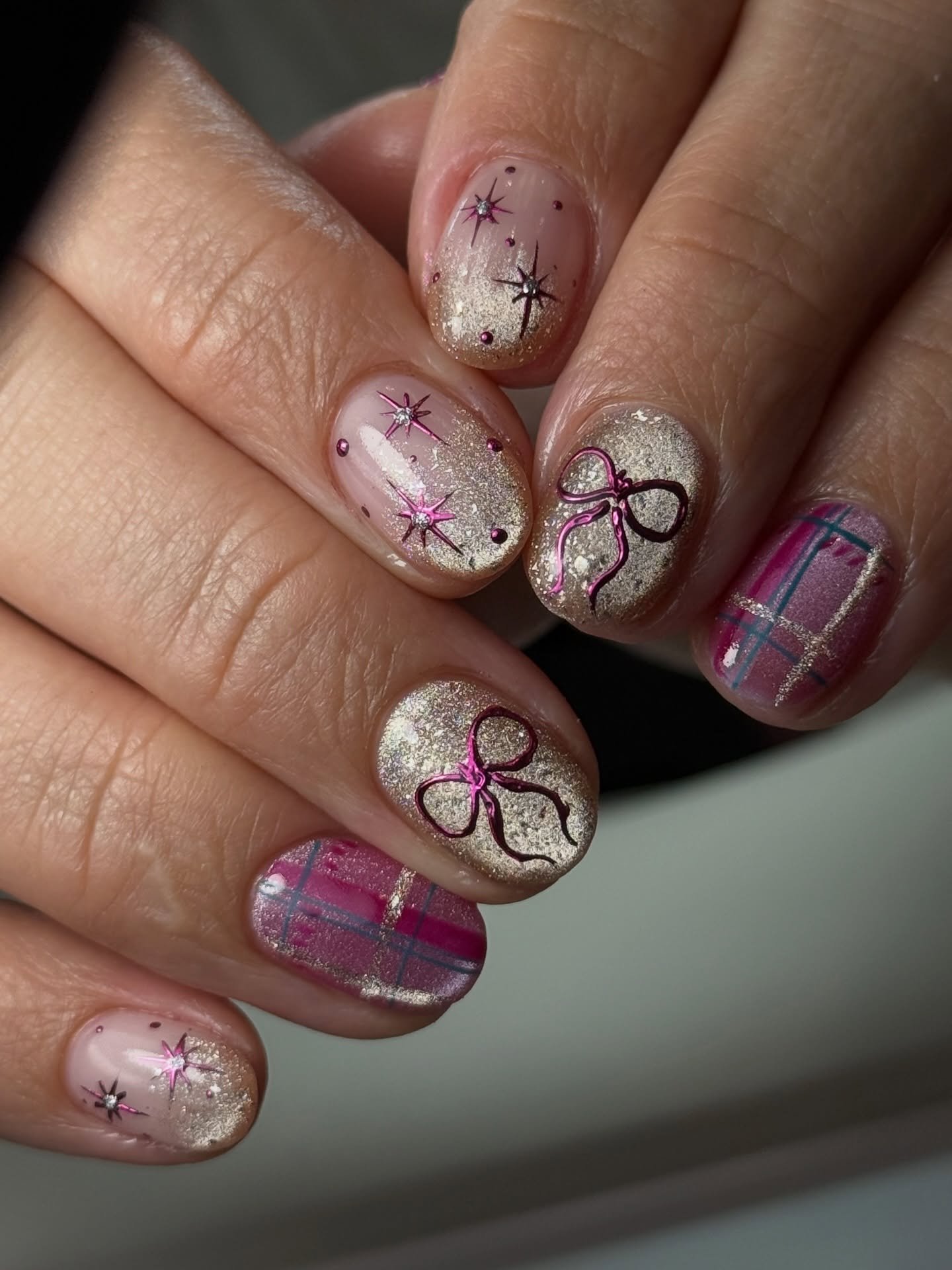 Soft Pink Christmas Nails with Bows, Stars and Plaid