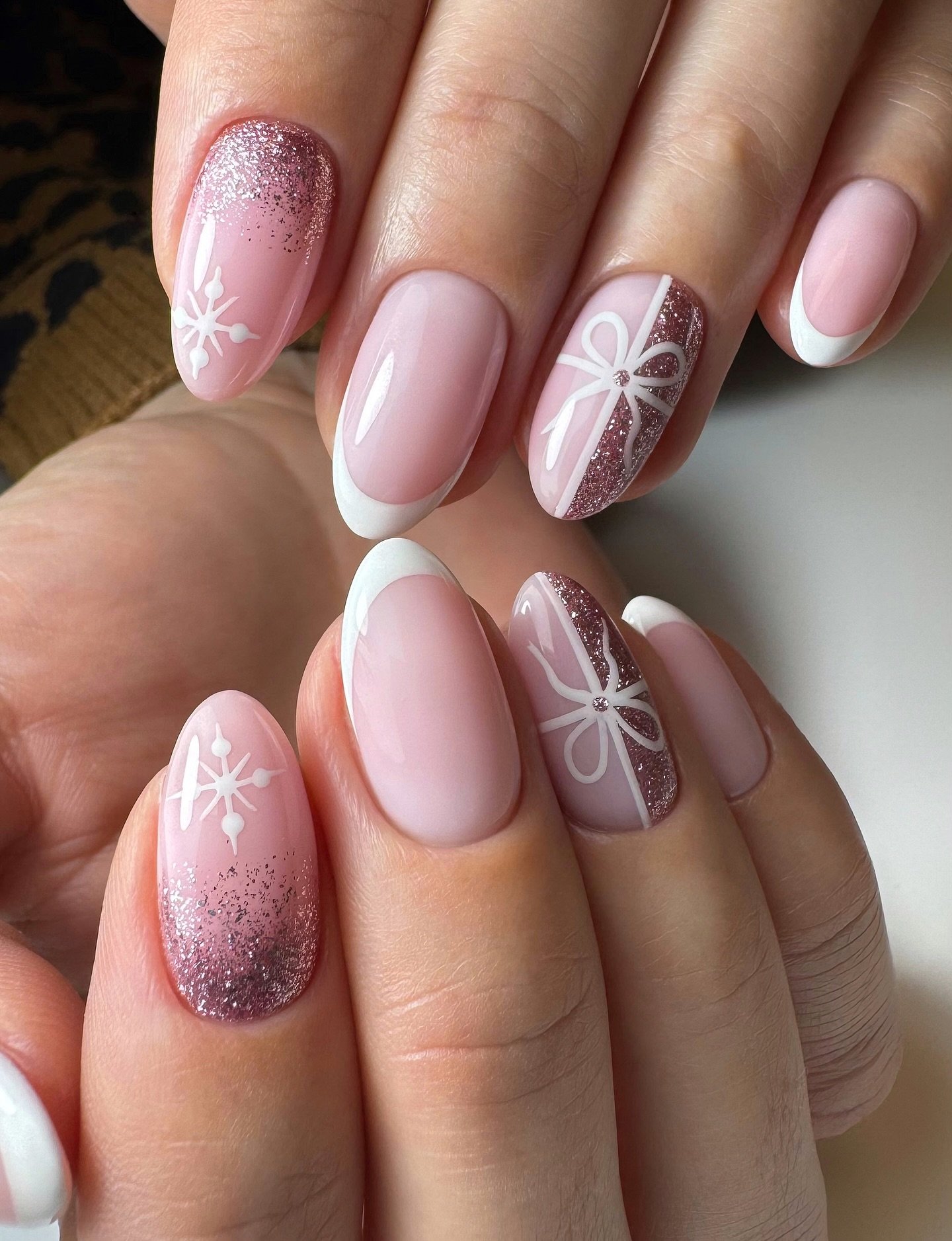 Pink French Almond Nails with Snowflakes and Glitter